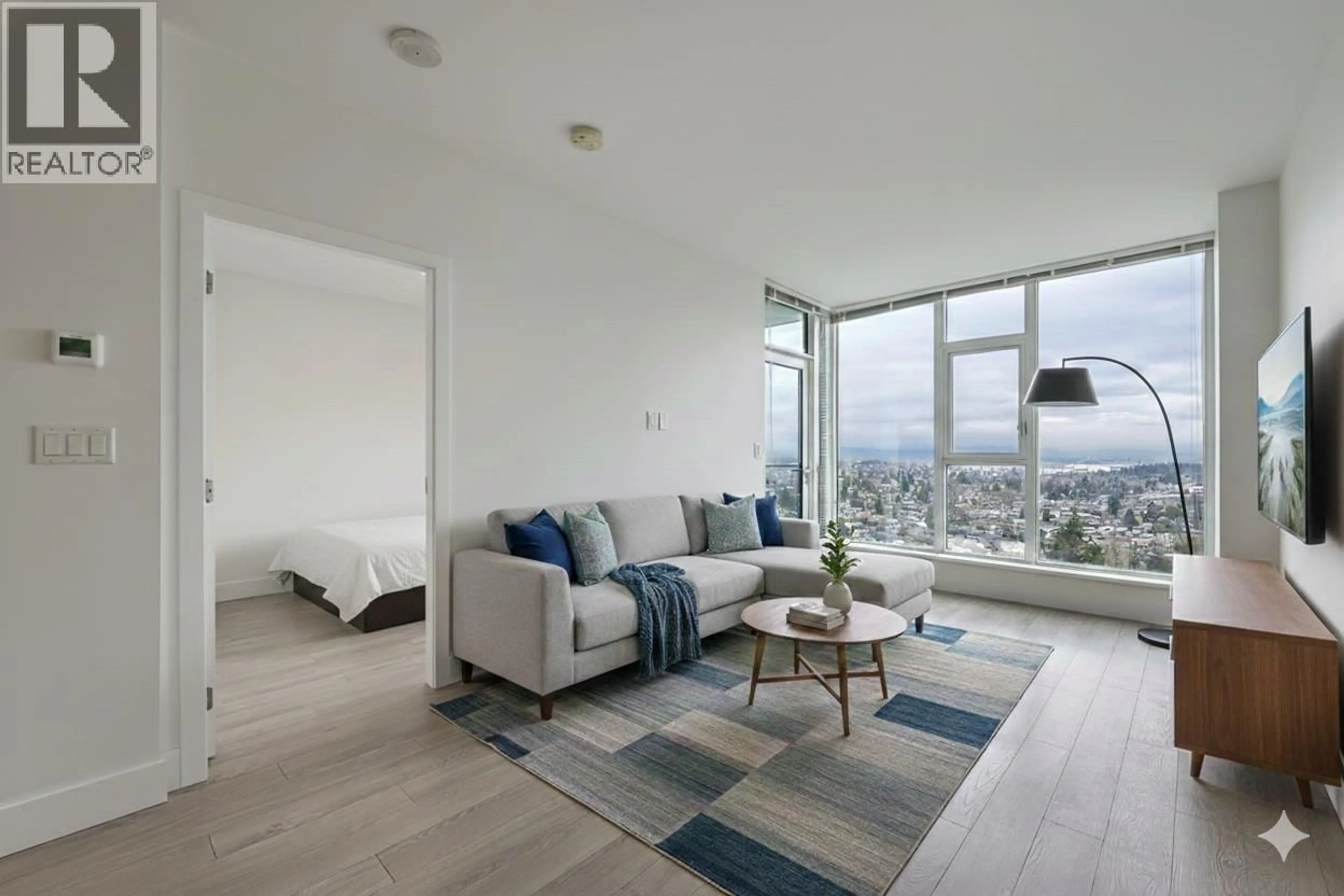 Living room with furniture, unknown for 2506 - 7388 KINGSWAY, Burnaby British Columbia V3N0G9