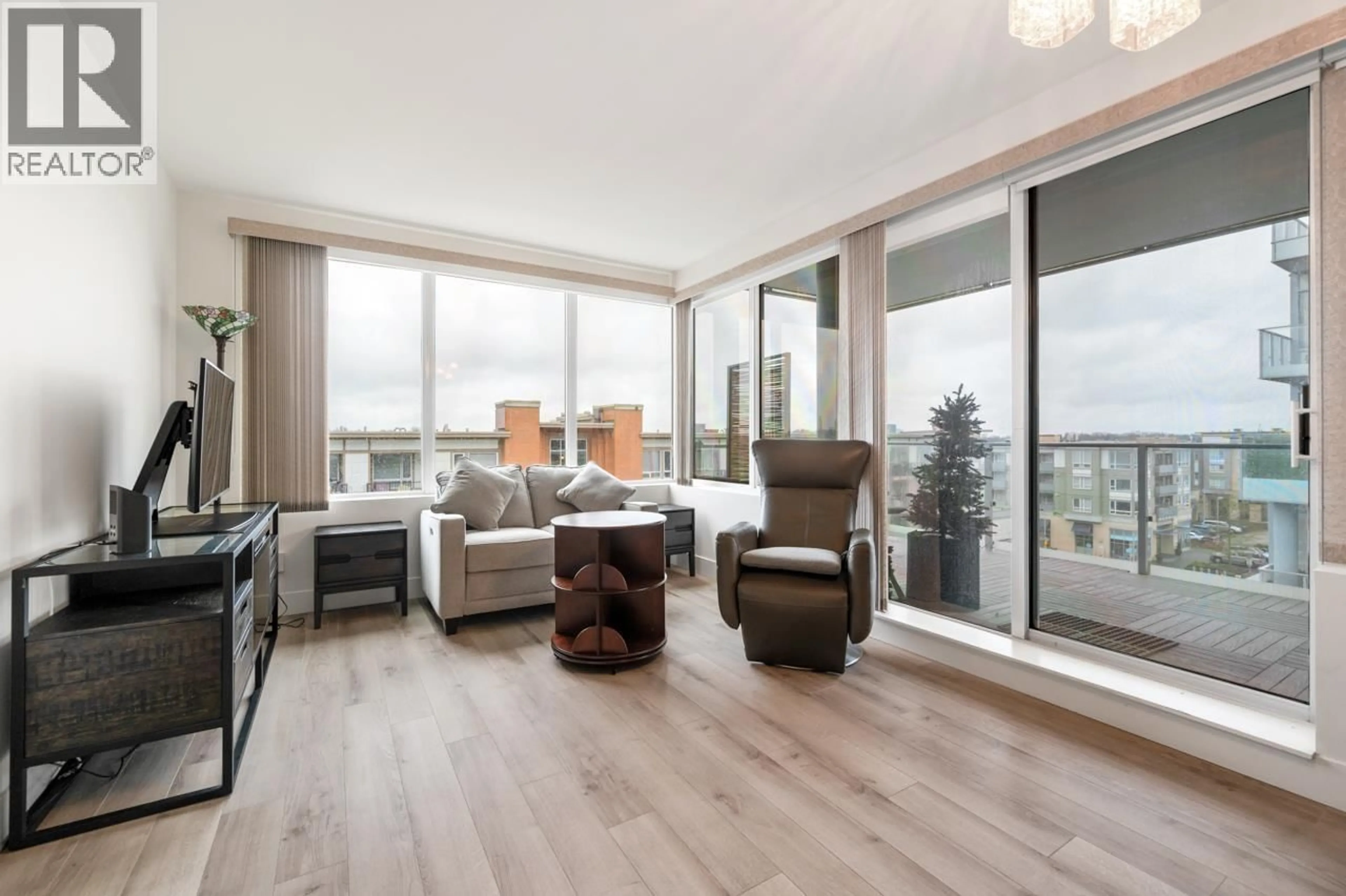 Living room with furniture, wood/laminate floor for 717 - 10788 NO. 5 ROAD, Richmond British Columbia V6W0B7