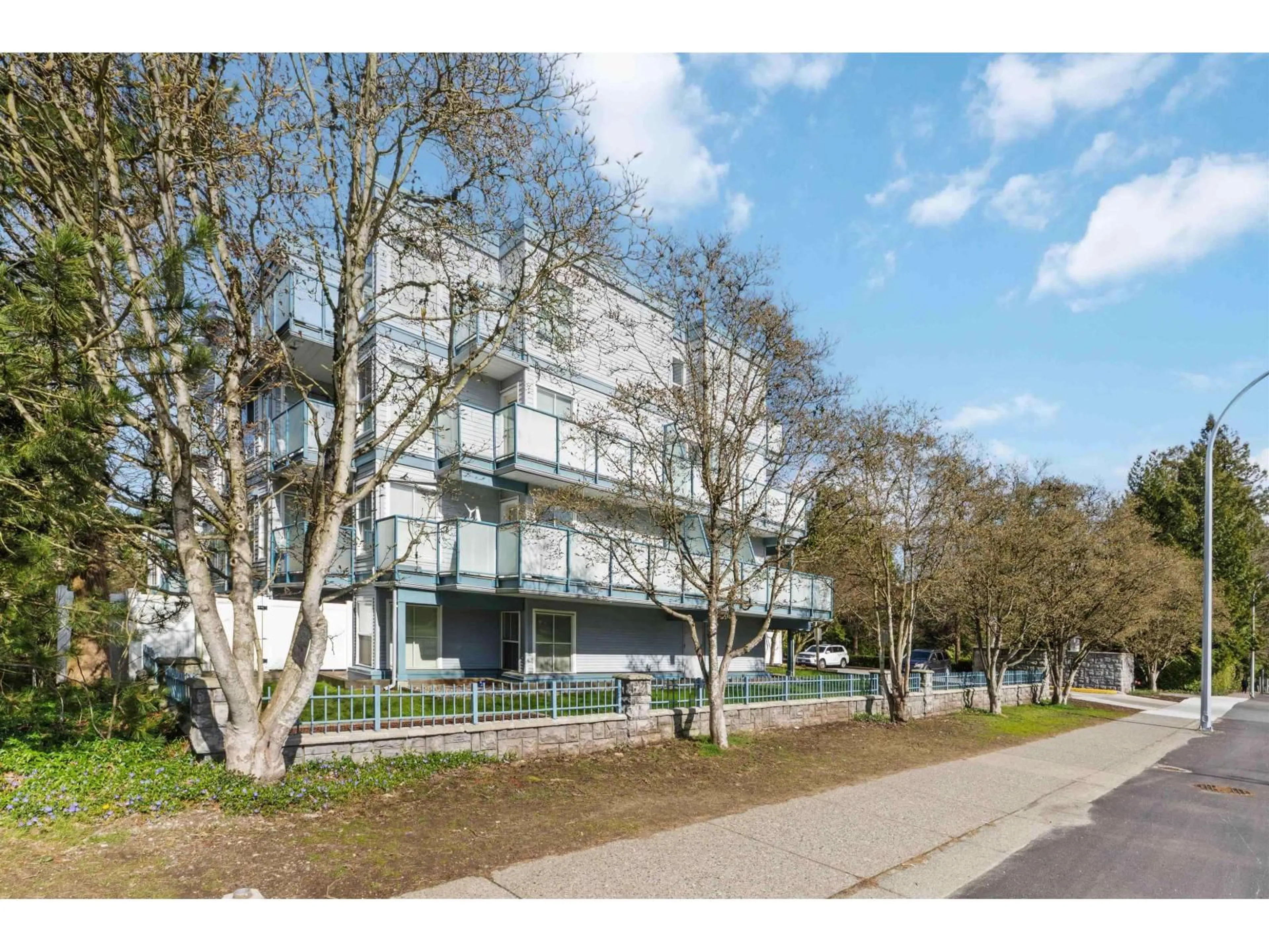 A pic from outside/outdoor area/front of a property/back of a property/a pic from drone, street for 204 - 14885 100 AVENUE, Surrey British Columbia V3R0W1