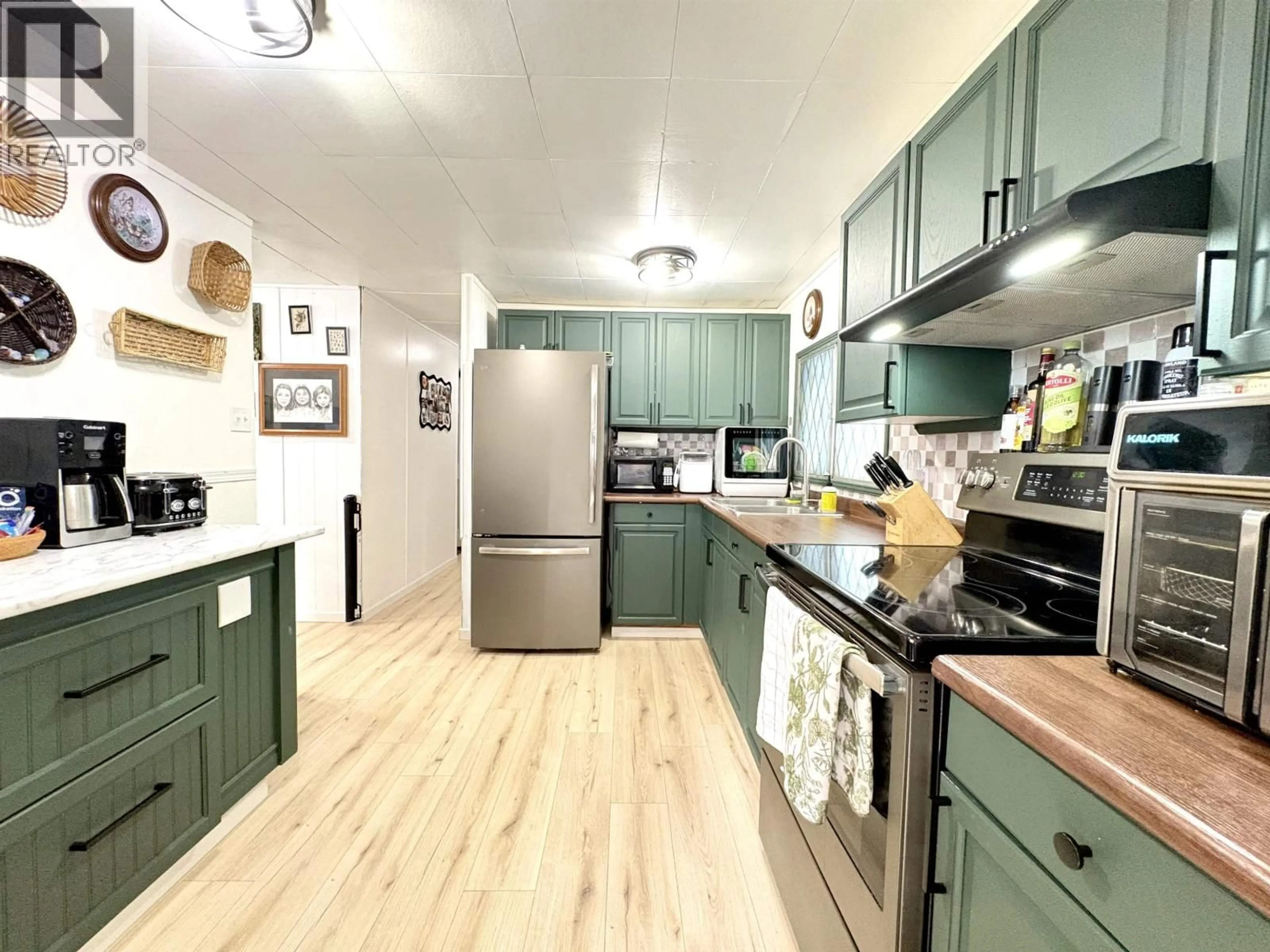 Open concept kitchen, wood/laminate floor for 3984 GLENDALE DRIVE, Prince George British Columbia V2K2V5