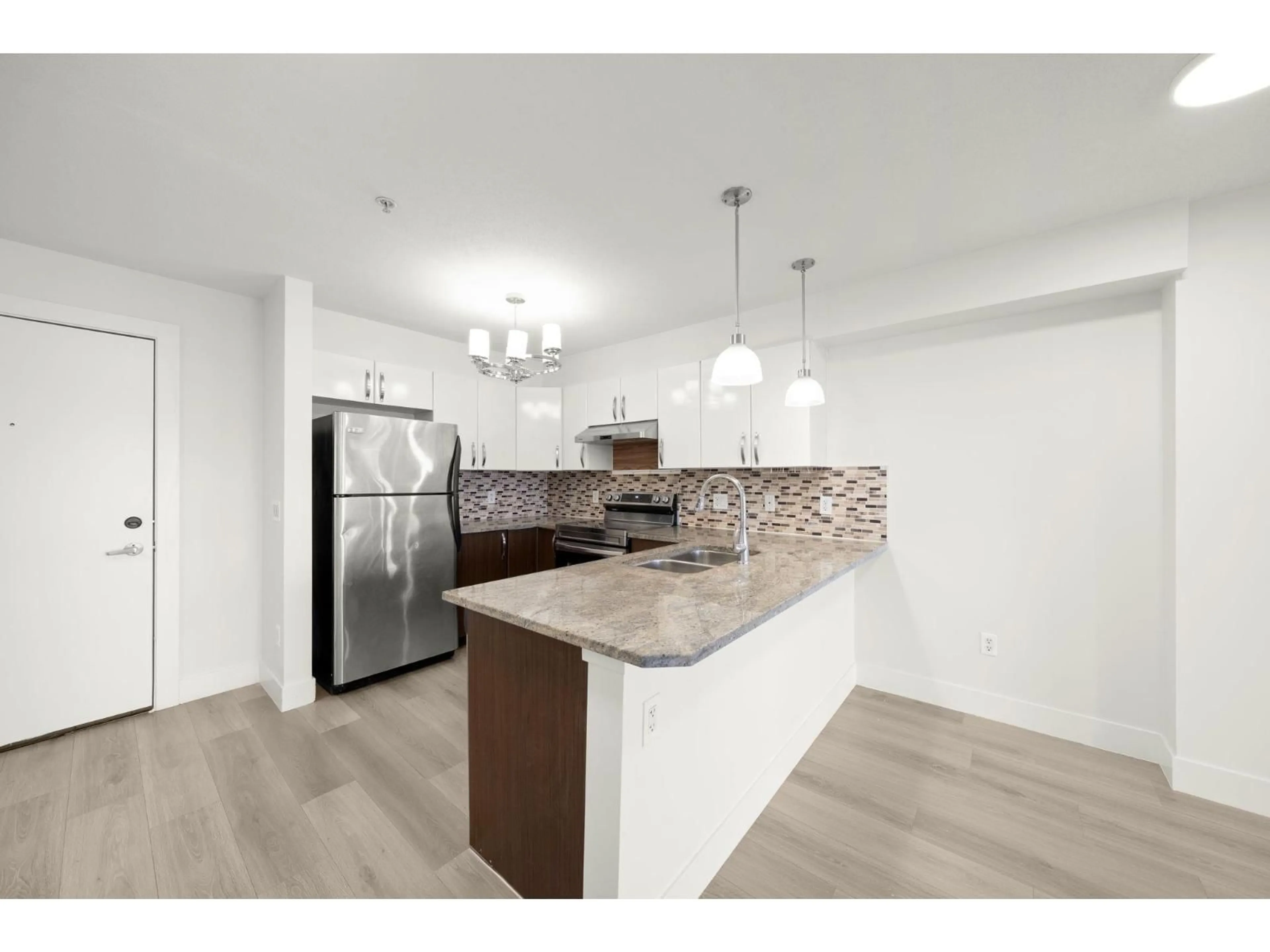 Open concept kitchen, unknown for 318 - 13555 GATEWAY DRIVE, Surrey British Columbia V3T0B5