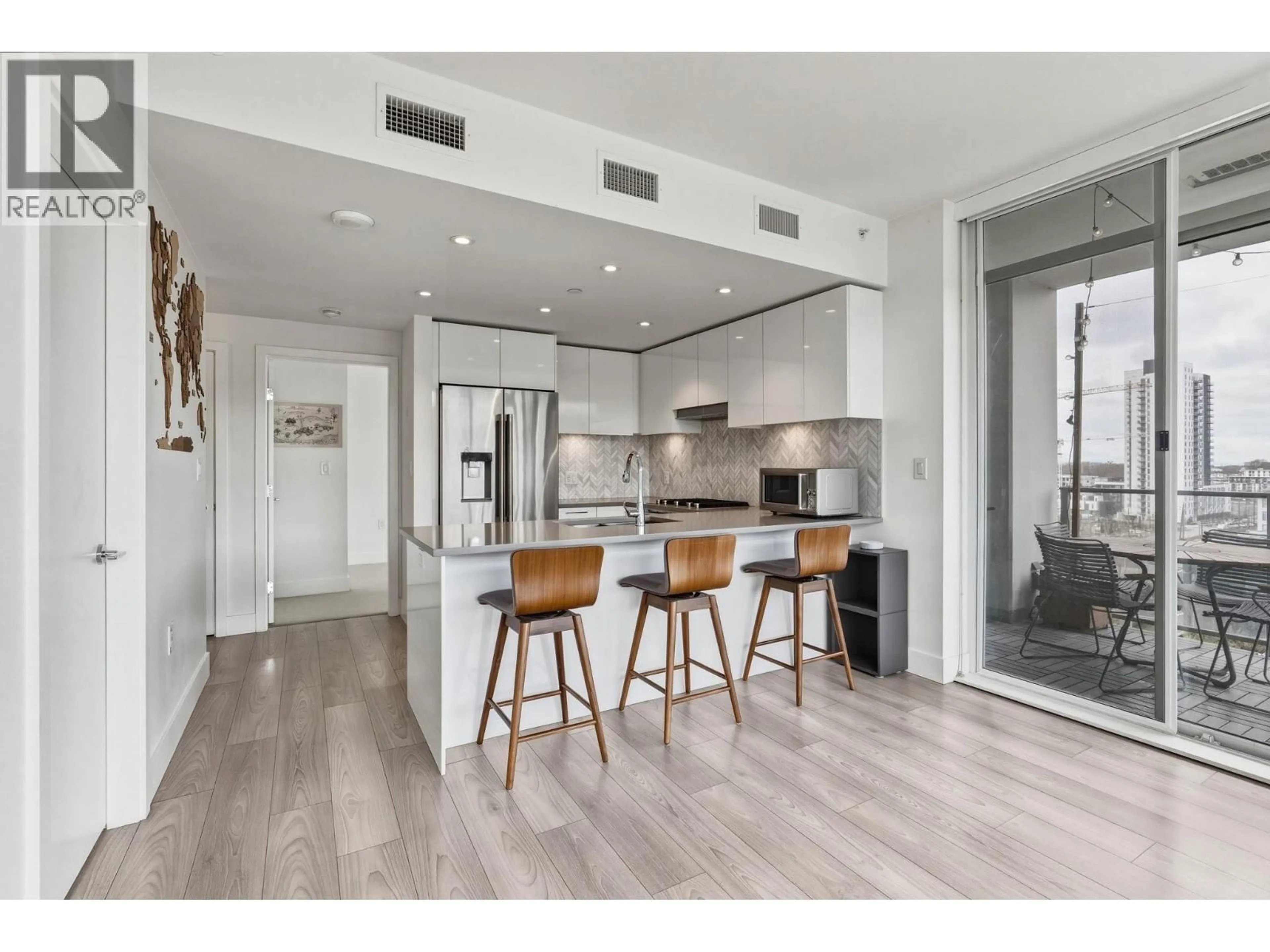 Open concept kitchen, wood/laminate floor for 905 - 8570 RIVERGRASS DRIVE, Vancouver British Columbia V5S0H4