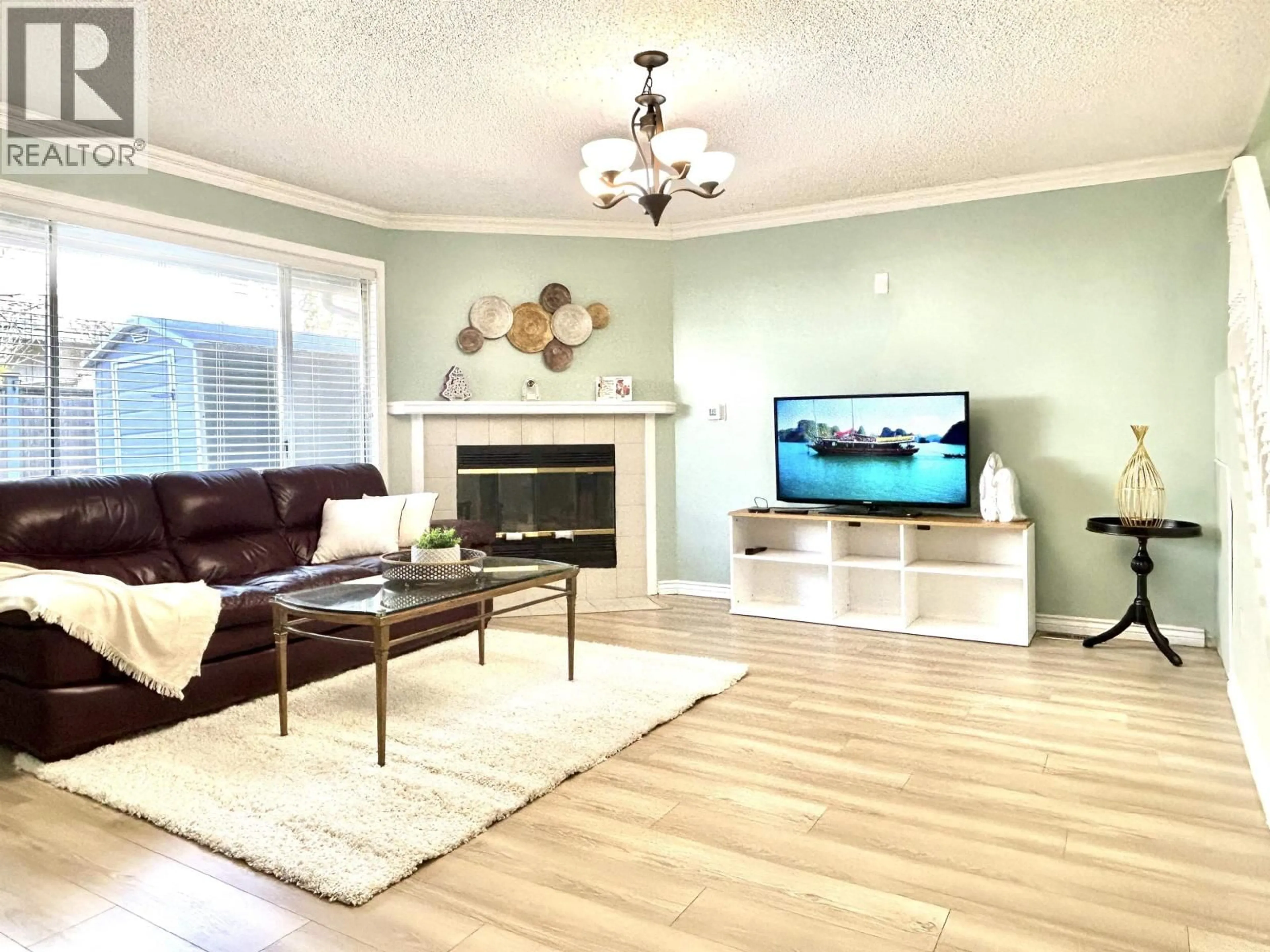 Living room with furniture, wood/laminate floor for 11 - 7871 FRANCIS ROAD, Richmond British Columbia V6Y3M4