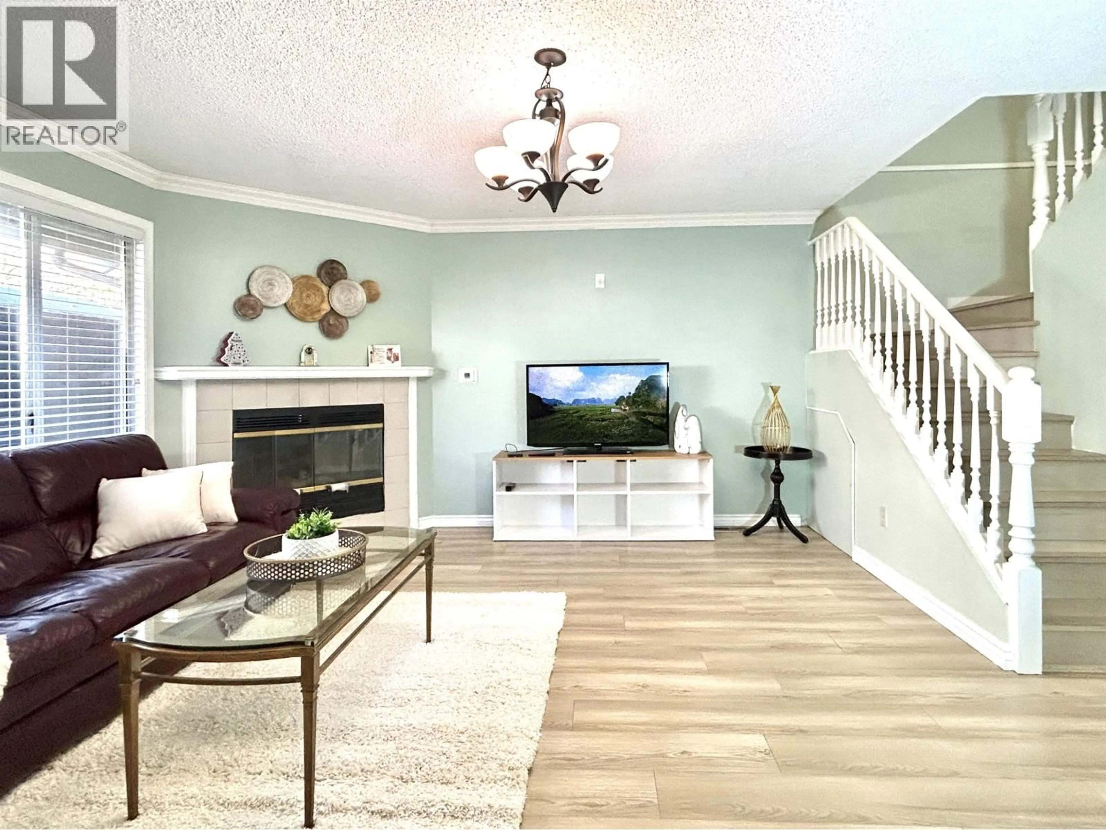 Living room with furniture, wood/laminate floor for 11 - 7871 FRANCIS ROAD, Richmond British Columbia V6Y3M4