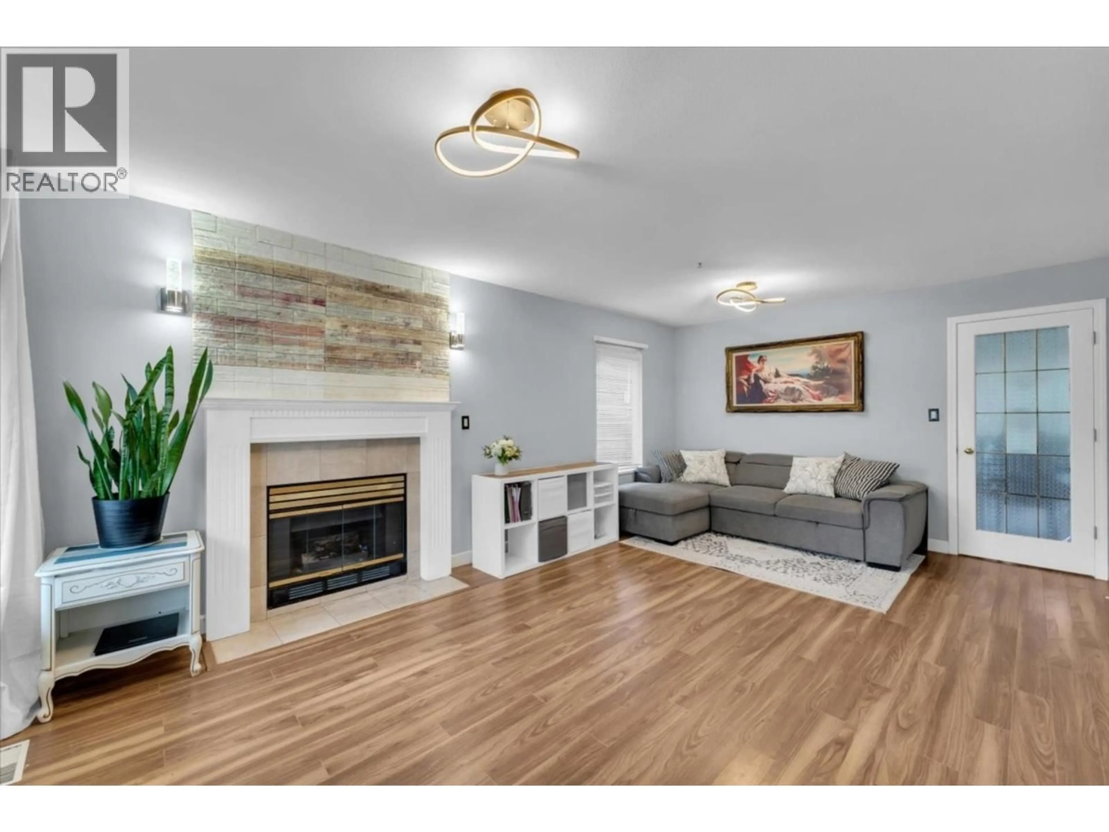 Living room with furniture, wood/laminate floor for 3 - 6675 NO. 2 ROAD, Richmond British Columbia V7C3L5