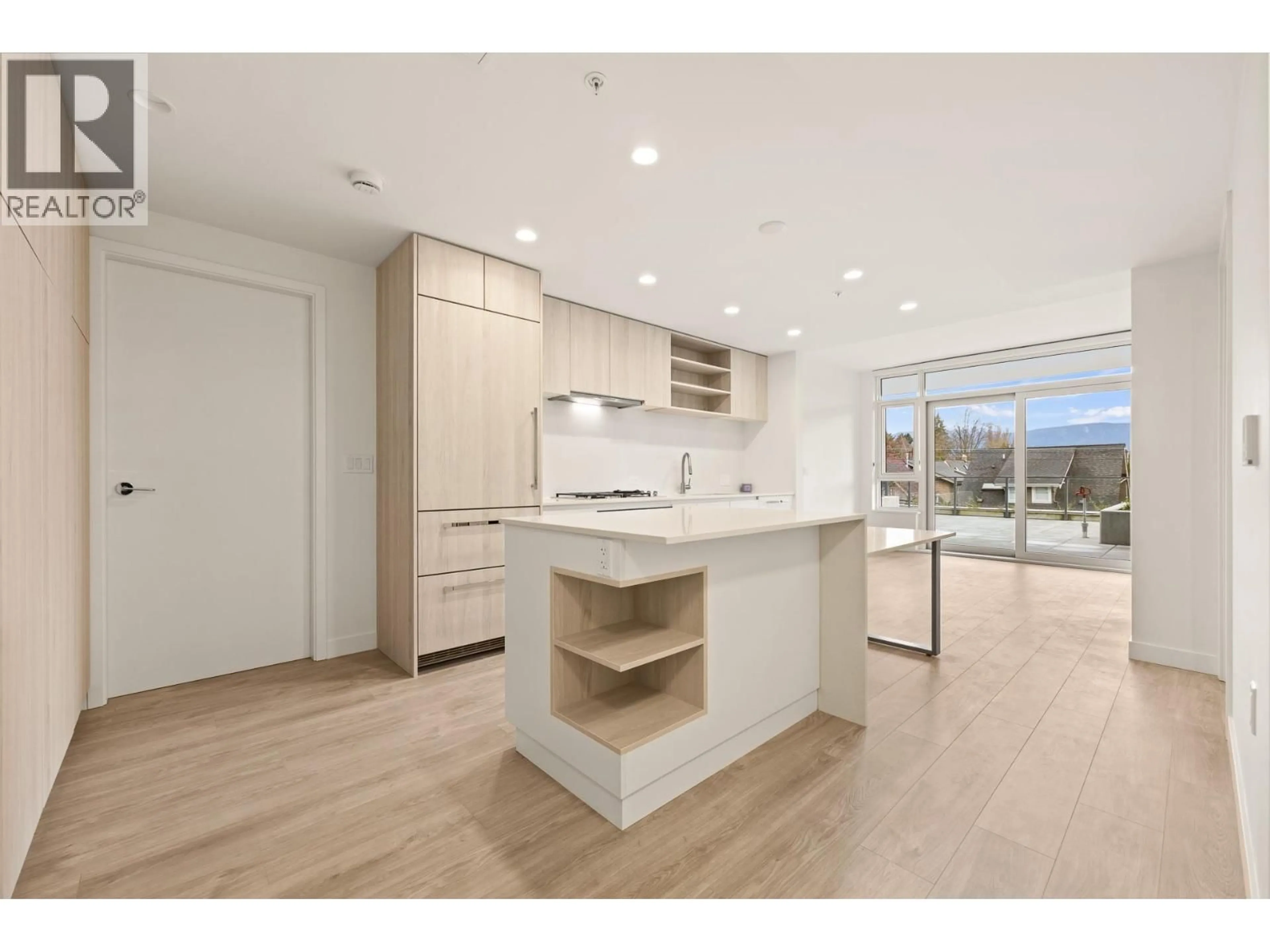 Open concept kitchen, wood/laminate floor for 220 - 1981 MACDONALD STREET, Vancouver British Columbia V6K0H9