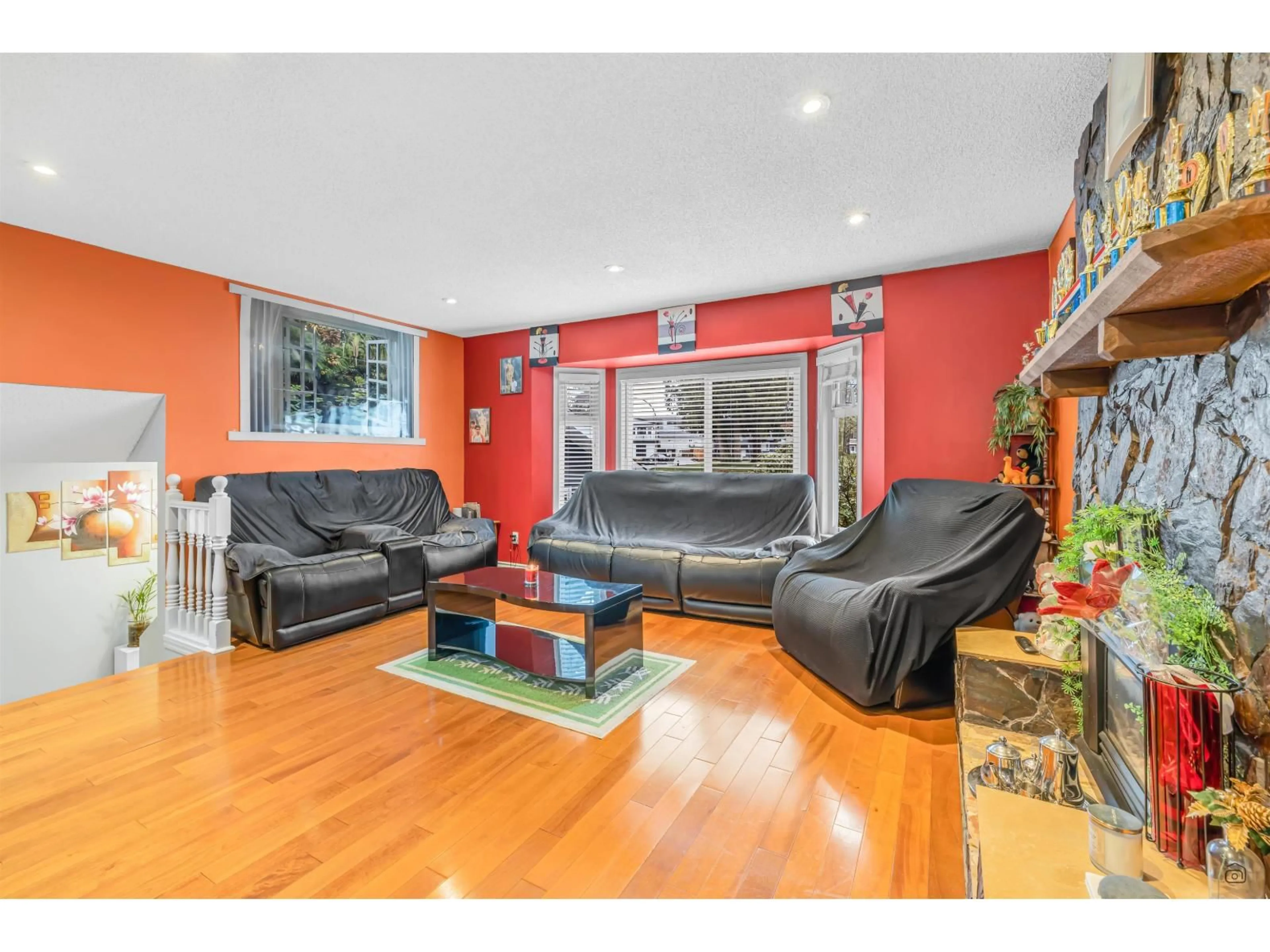 Living room with furniture, wood/laminate floor for 13277 64A AVENUE, Surrey British Columbia V3W7H9