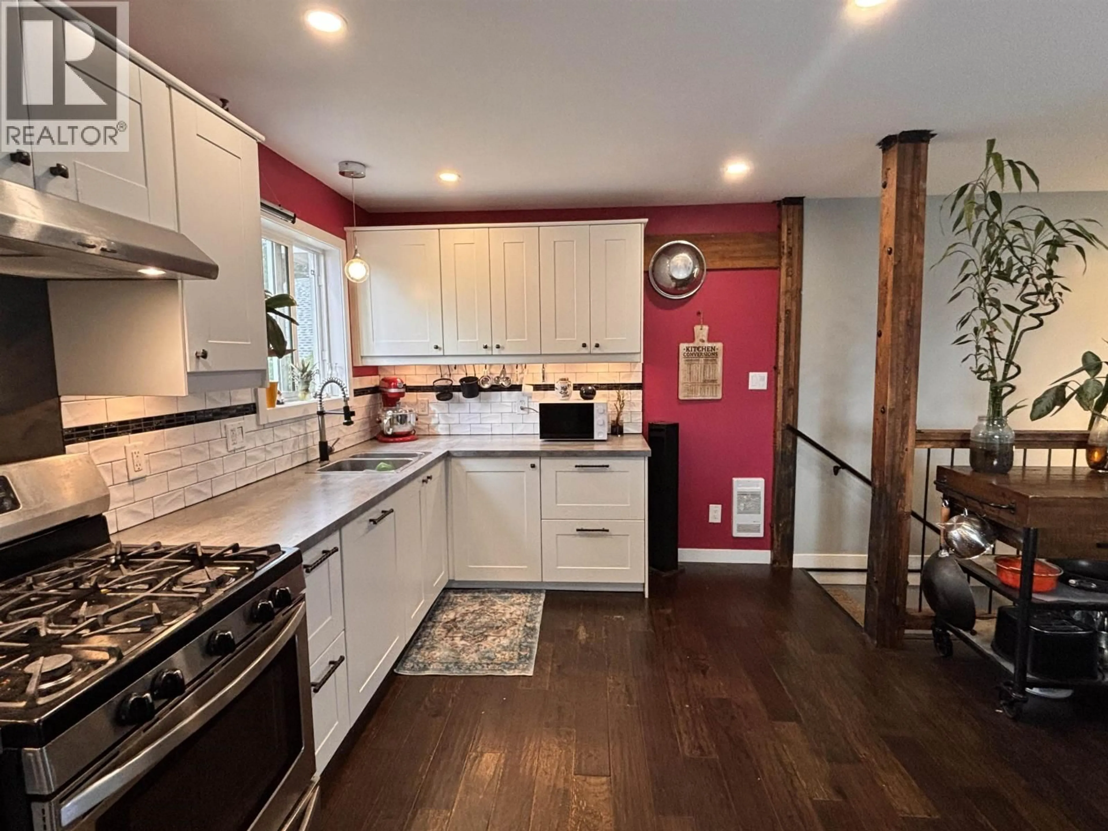 Open concept kitchen, wood/laminate floor for 6201 FINN ROAD, 100 Mile House British Columbia V0K2E3
