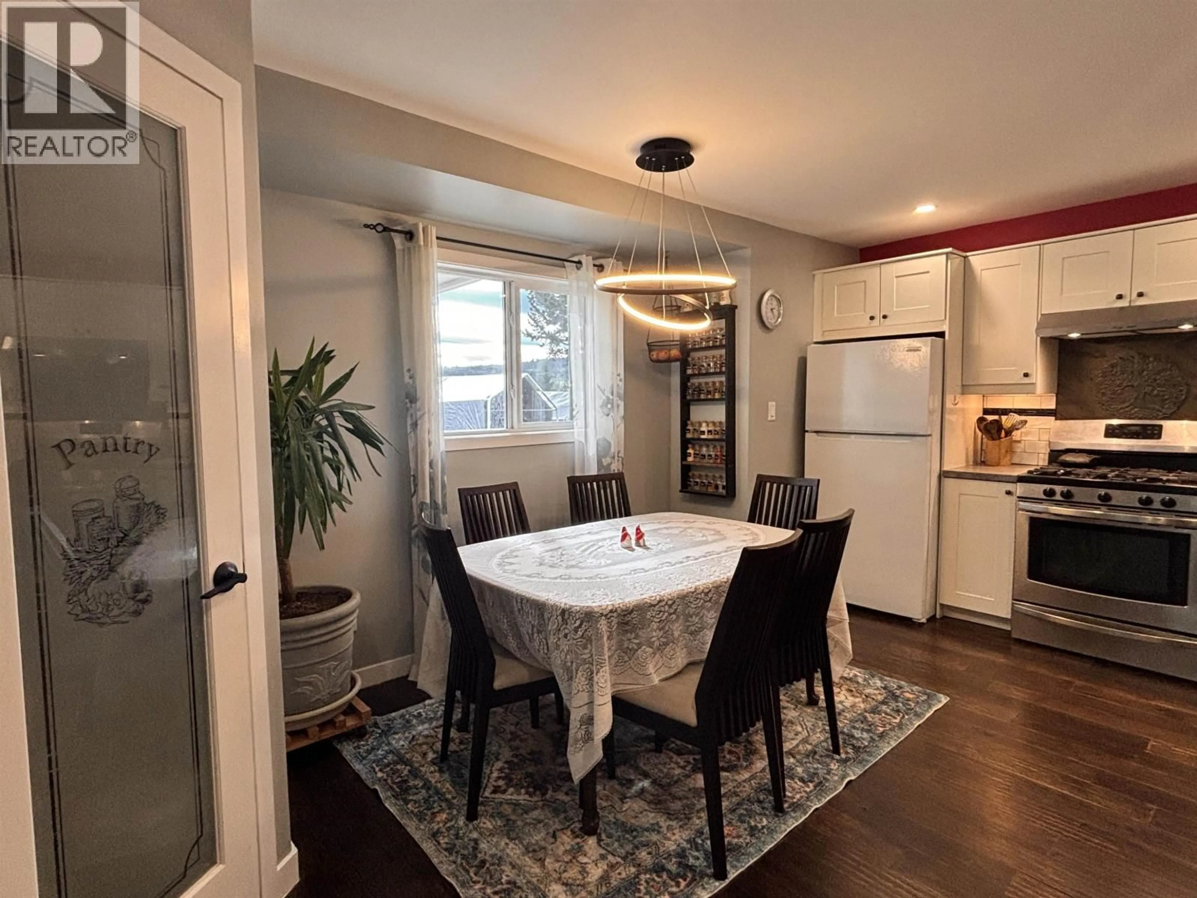 Dining room, wood/laminate floor for 6201 FINN ROAD, 100 Mile House British Columbia V0K2E3