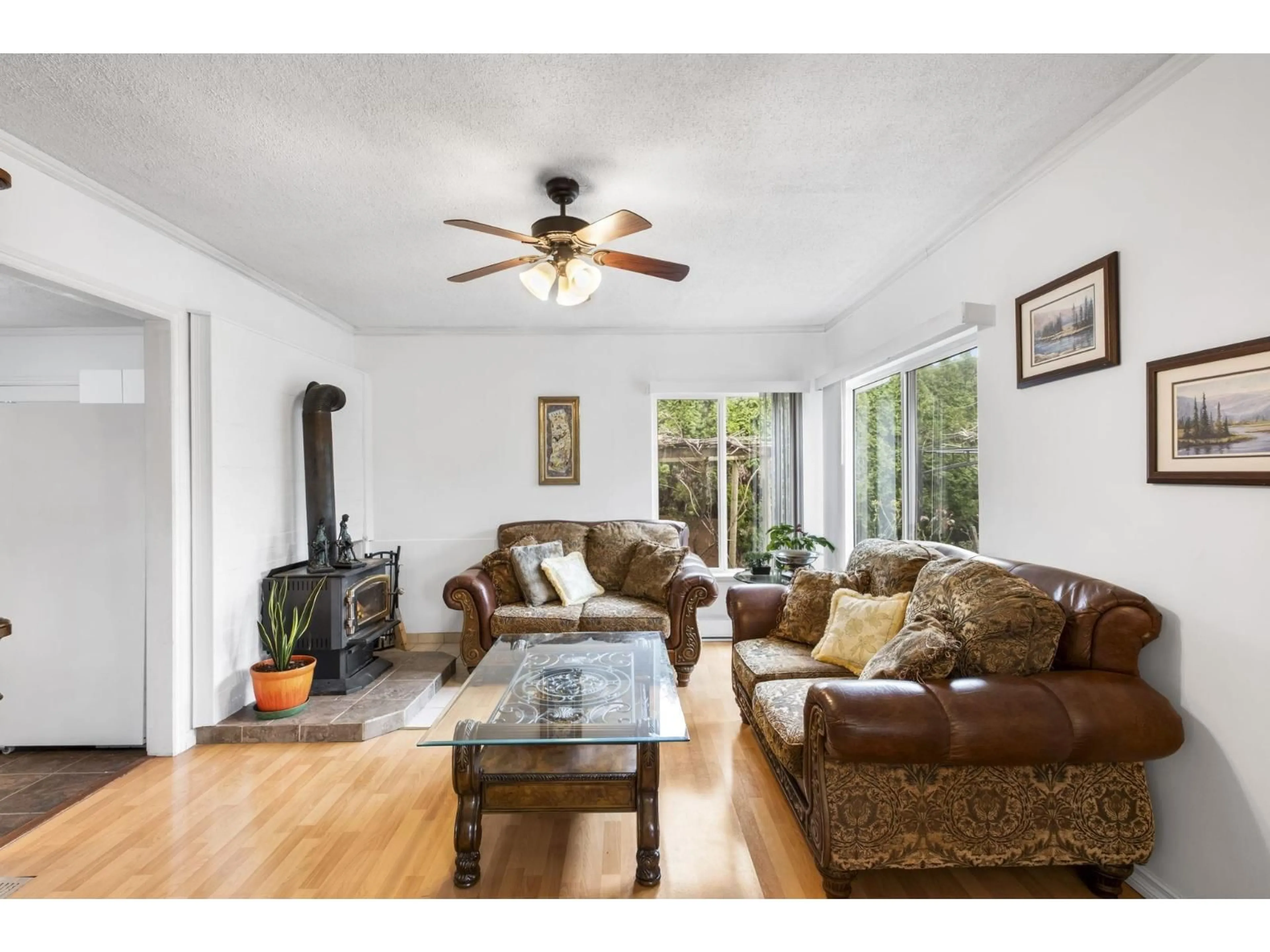 Living room with furniture, wood/laminate floor for 7566 DUNSMUIR STREET, Mission British Columbia V2V4B4