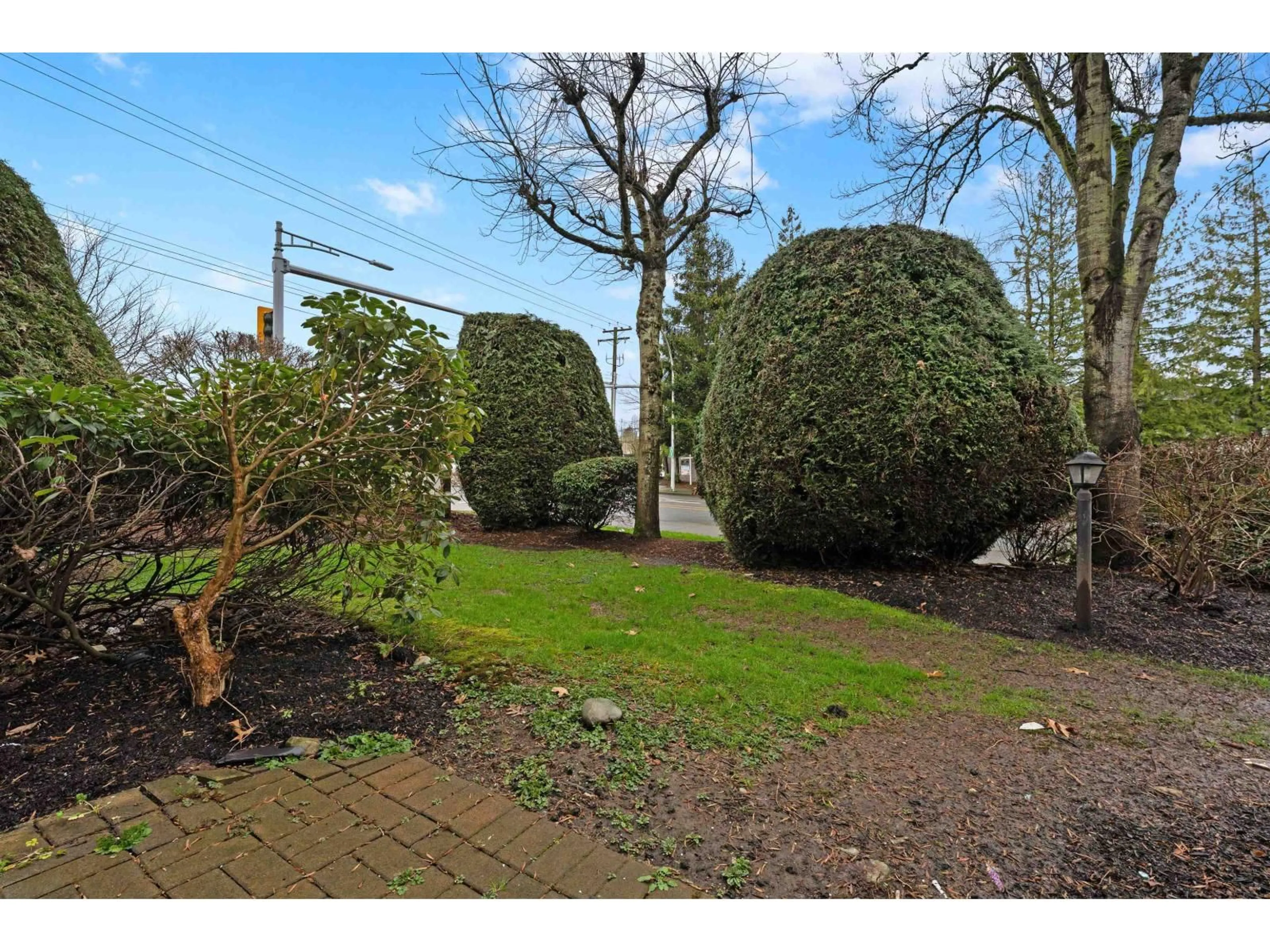 A pic from outside/outdoor area/front of a property/back of a property/a pic from drone, street for 111 - 7171 121 STREET, Surrey British Columbia V3W1G9