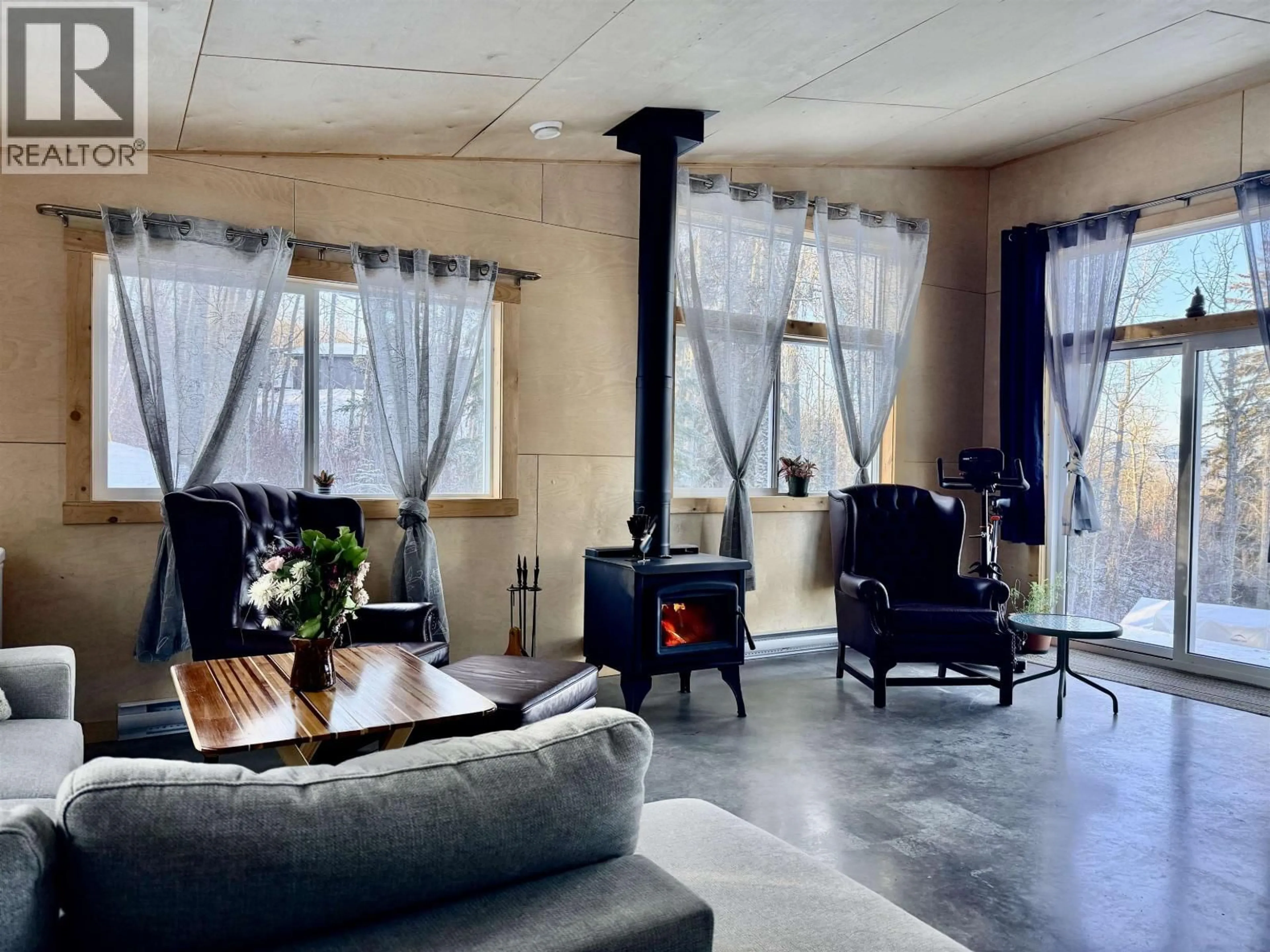 Living room with furniture, cement floor for 7509 FIR ROAD, Telkwa British Columbia V0J2X1