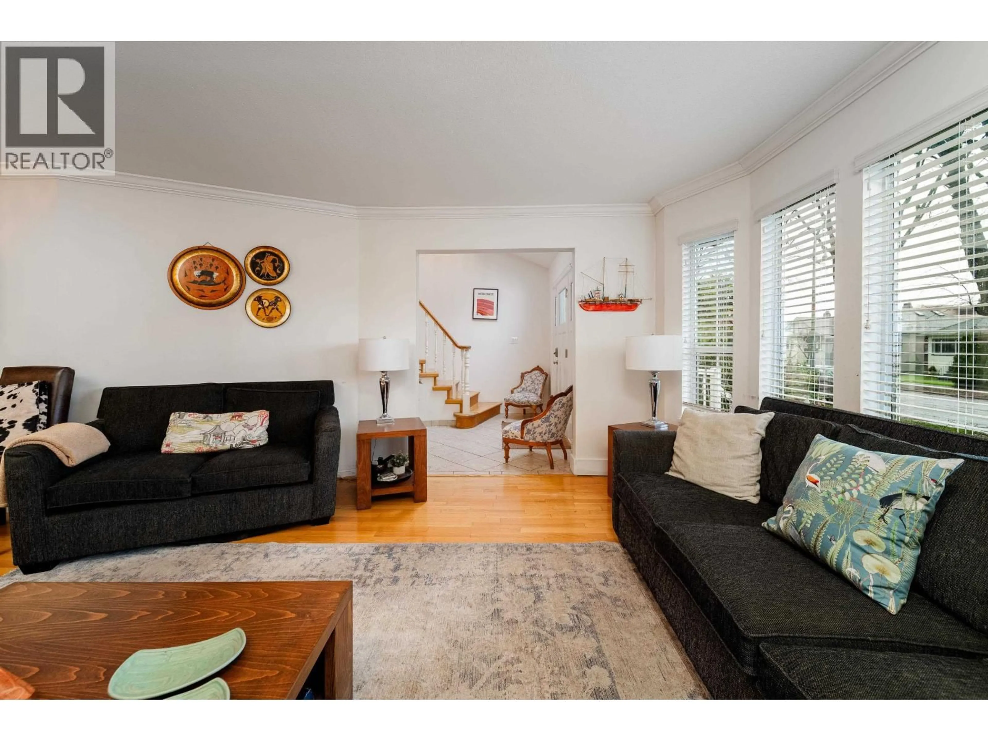 Living room with furniture, wood/laminate floor for 3528 10TH AVENUE, Vancouver British Columbia V6R2G1