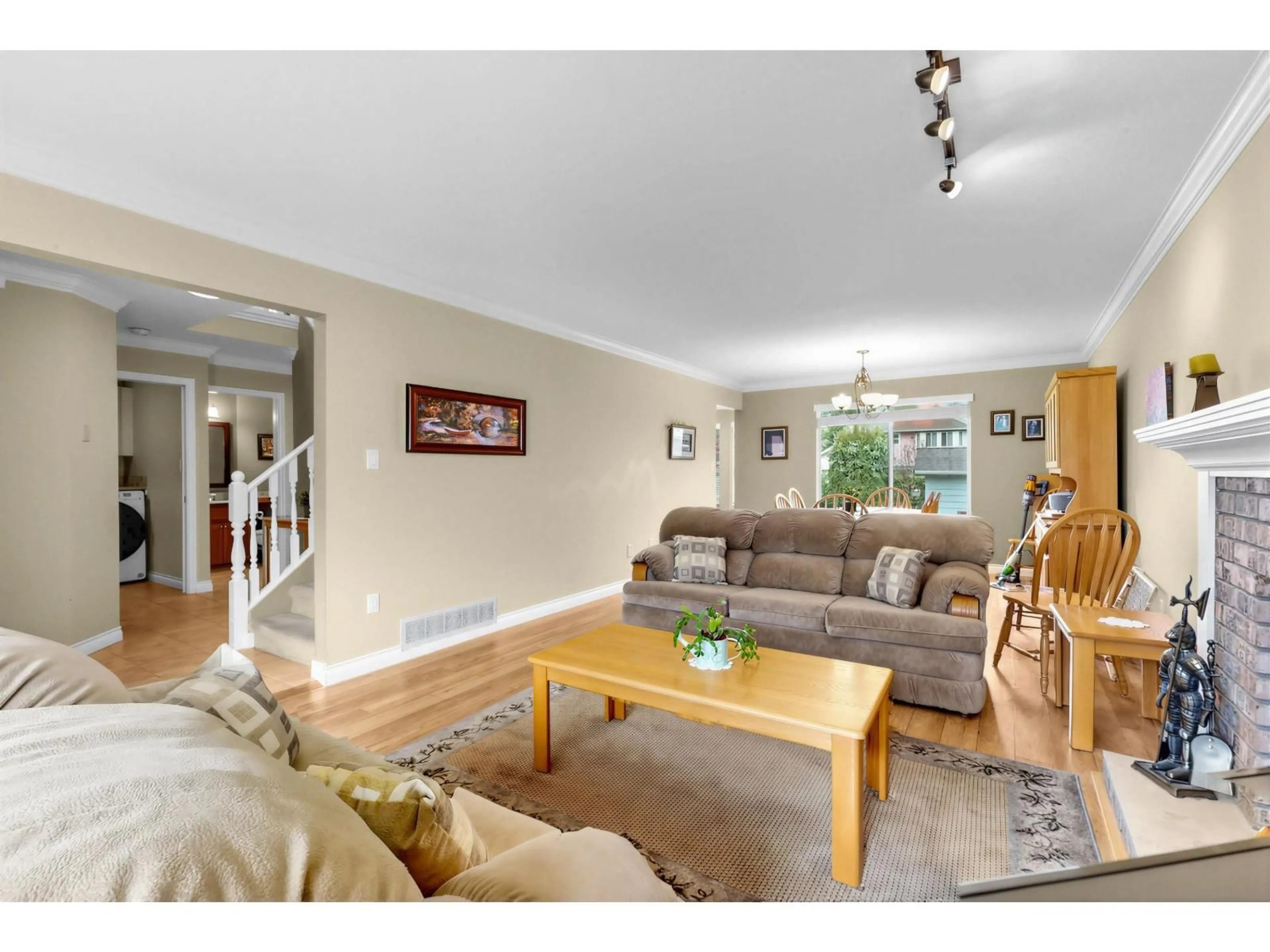 Living room with furniture, wood/laminate floor for 15929 88A AVENUE, Surrey British Columbia V4N2X9