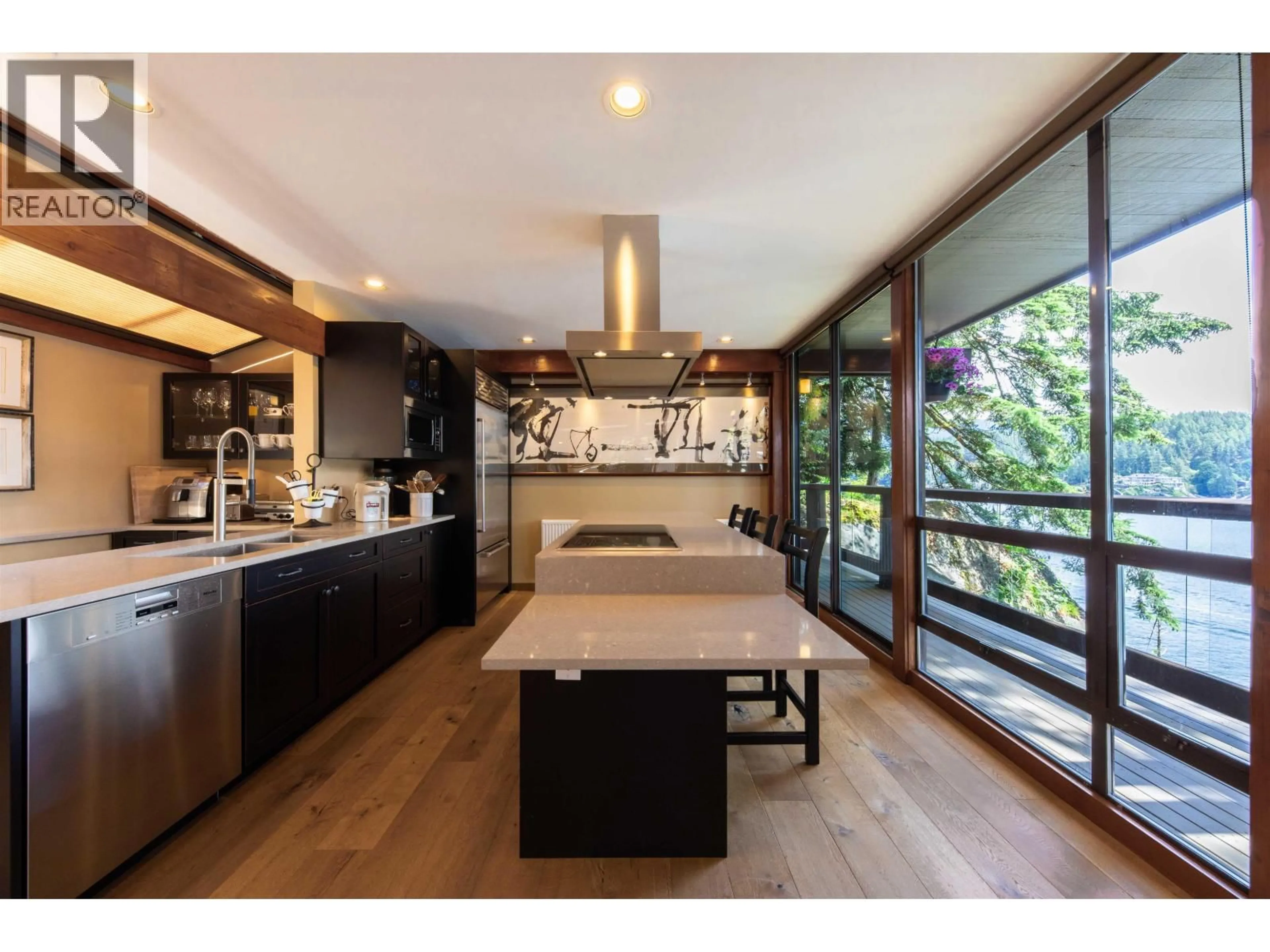 Open concept kitchen, wood/laminate floor for 4885 COVE CLIFF PLACE, North Vancouver British Columbia V7G1H9