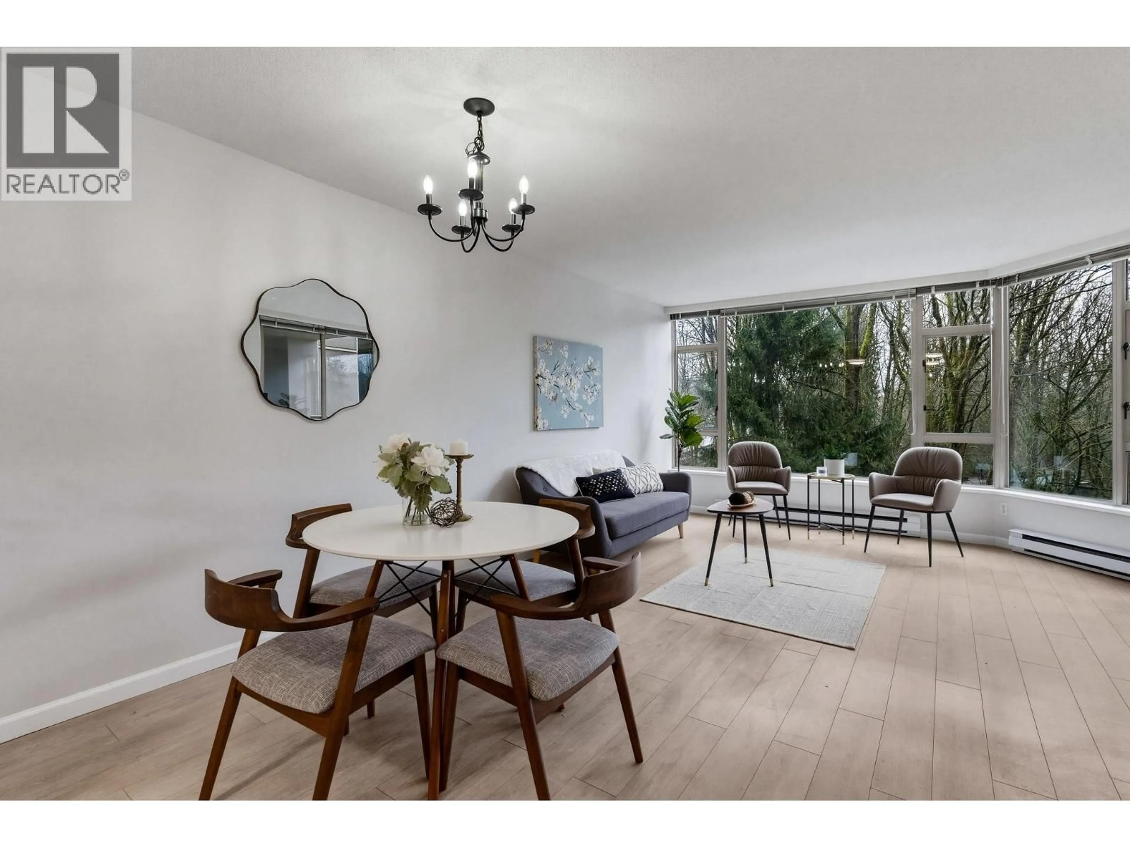 Living room with furniture, wood/laminate floor for 509 - 1327 KEITH ROAD, North Vancouver British Columbia V7J3T5