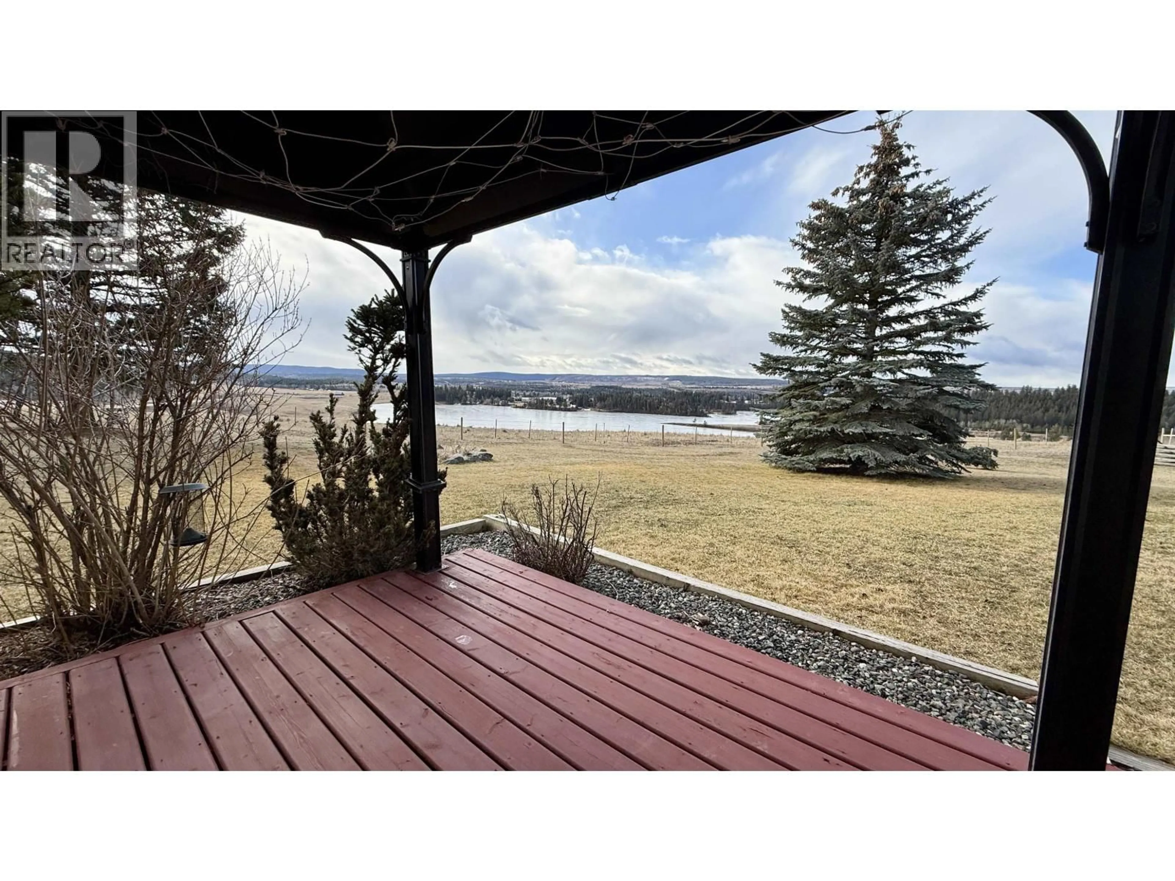 A pic from outside/outdoor area/front of a property/back of a property/a pic from drone, water/lake/river/ocean view for 5466 DONSLEEQUA COURT, 108 Mile Ranch British Columbia V0K2Z0
