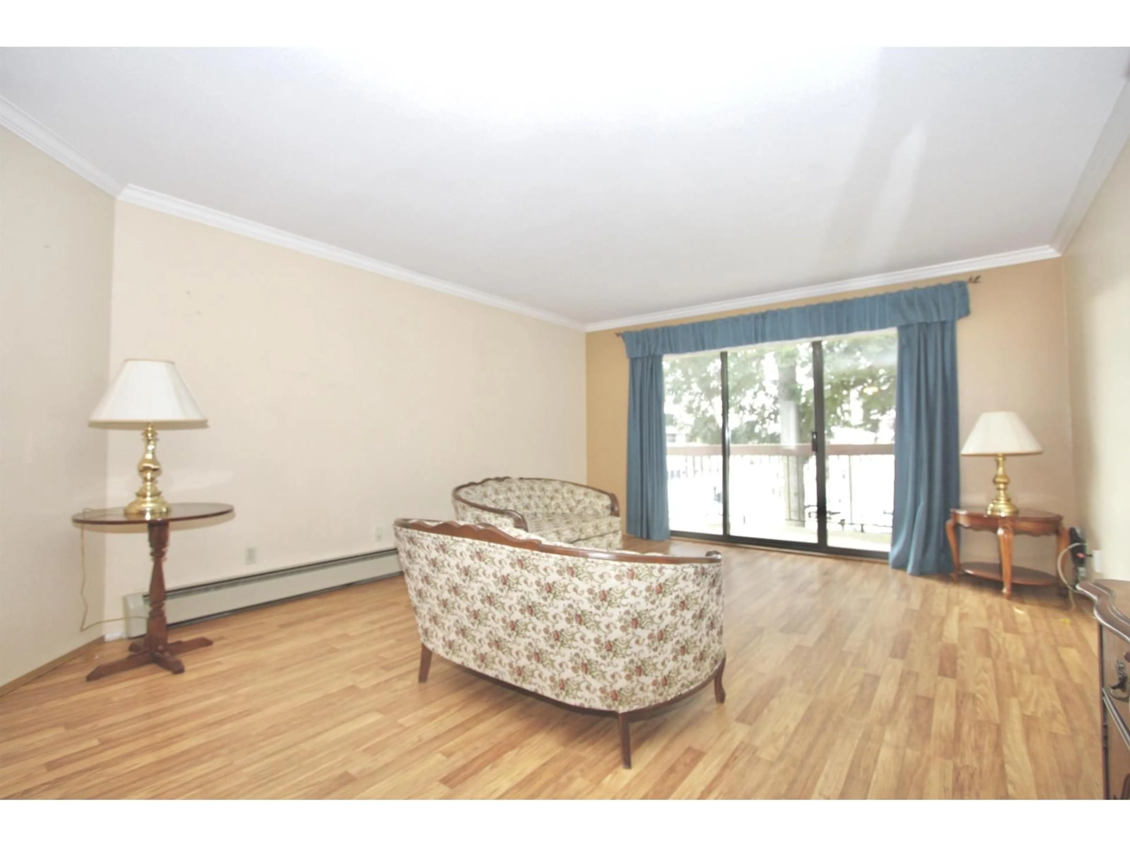 Living room with furniture, wood/laminate floor for 336 - 31955 OLD YALE ROAD, Abbotsford British Columbia V2T4N1