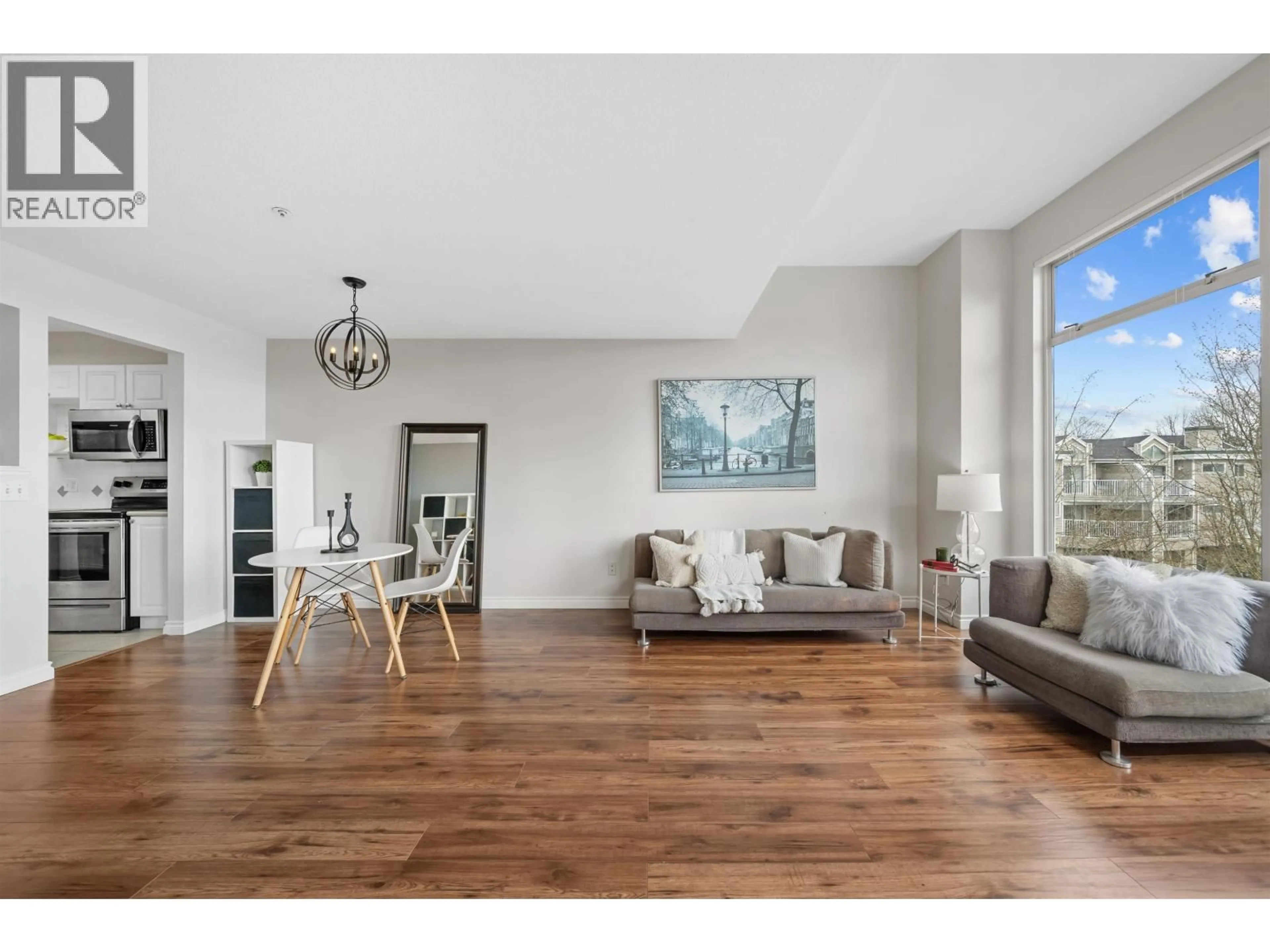 Living room with furniture, wood/laminate floor for 307 - 19131 FORD ROAD, Pitt Meadows British Columbia V3Y2R5