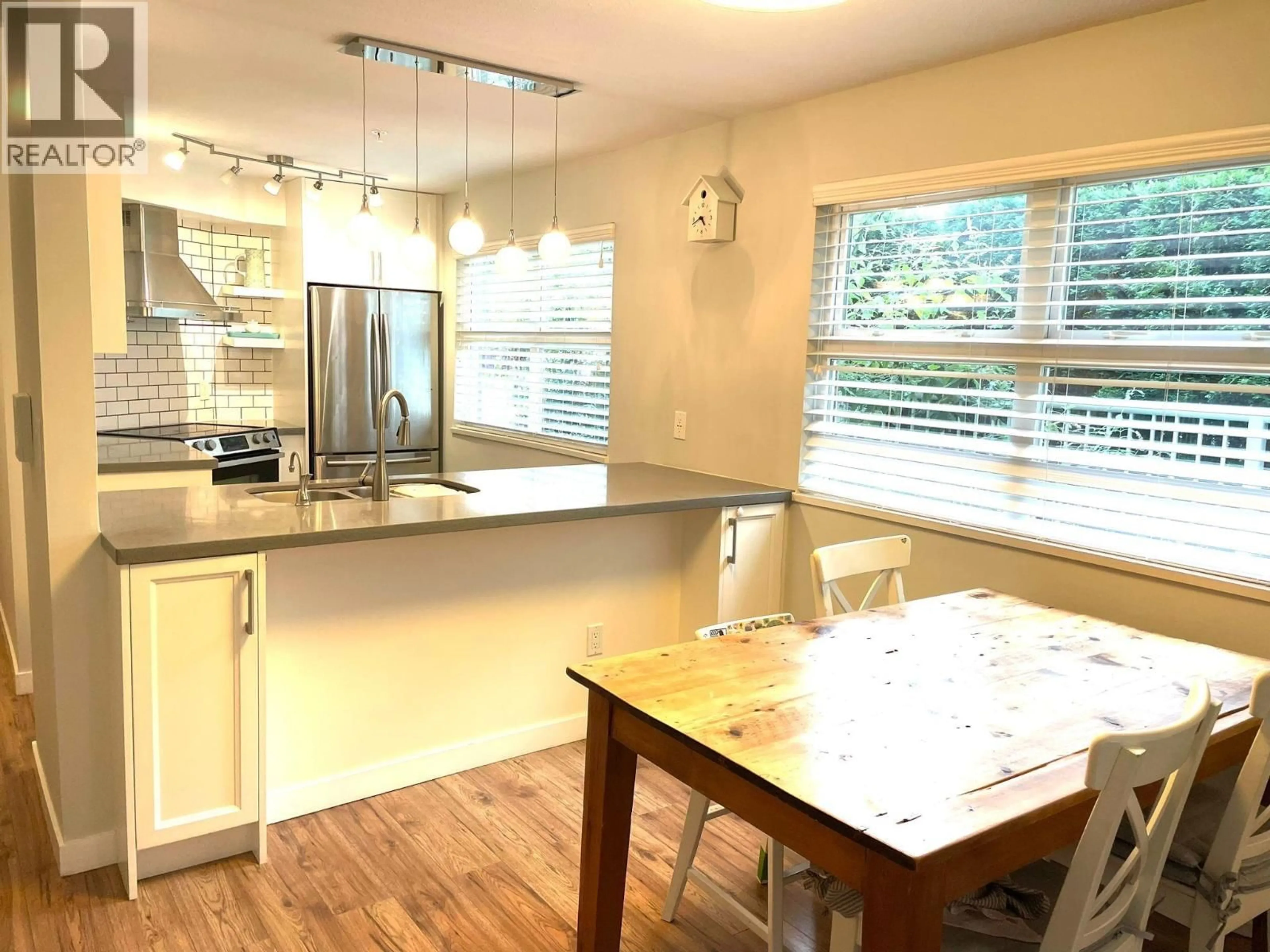 Open concept kitchen, wood/laminate floor for 102 - 3008 WILLOW STREET, Vancouver British Columbia V5Z3P3