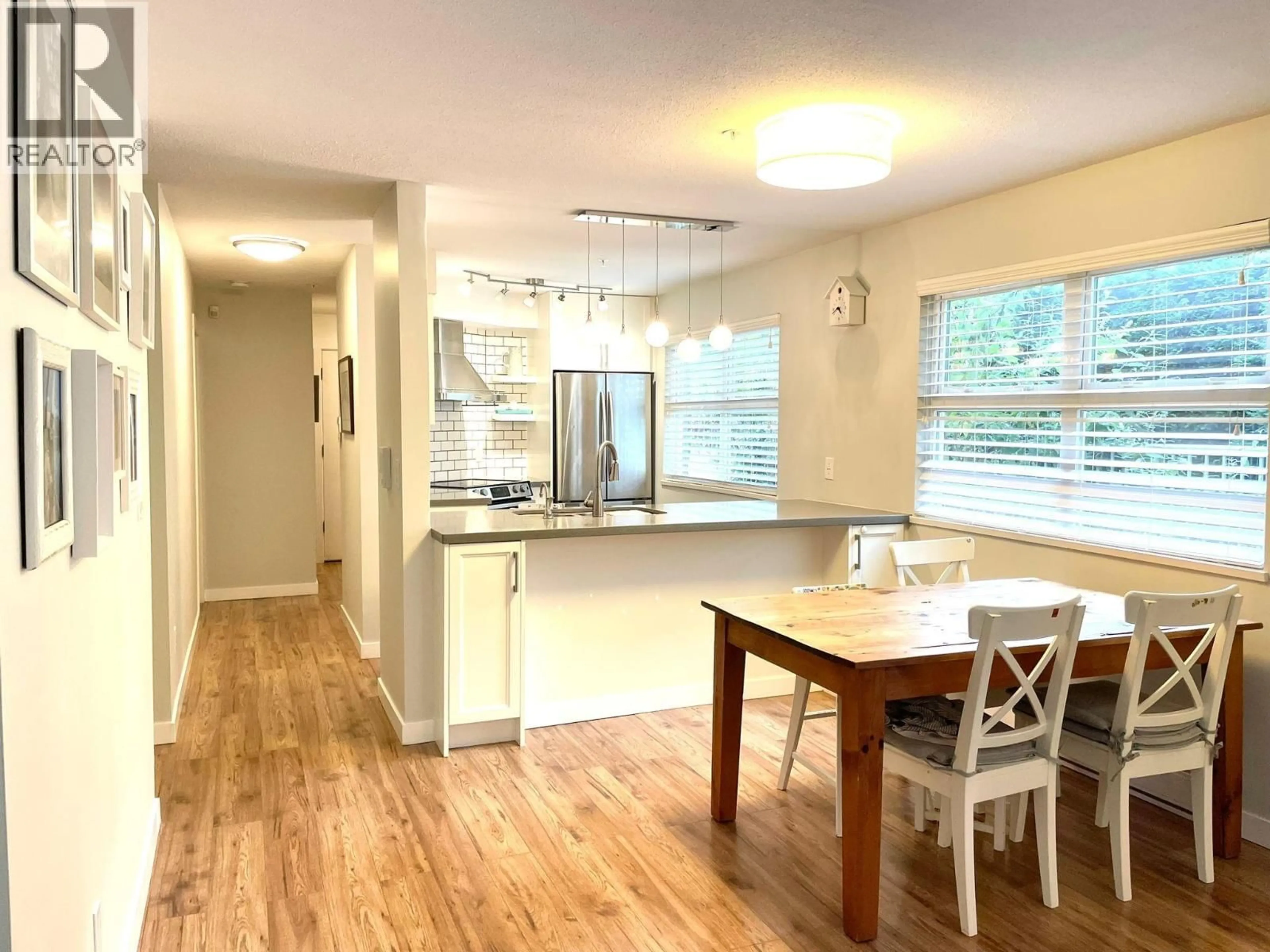 Open concept kitchen, wood/laminate floor for 102 - 3008 WILLOW STREET, Vancouver British Columbia V5Z3P3