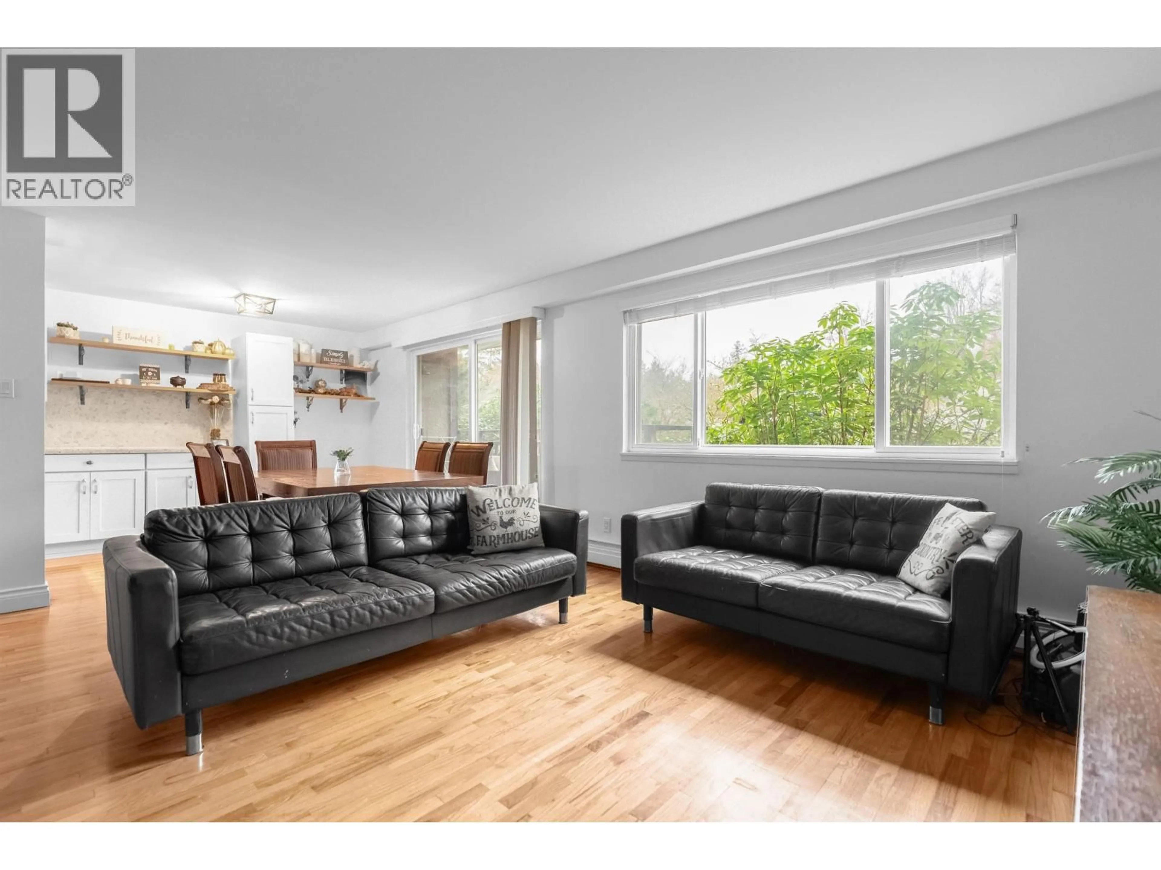 Living room with furniture, wood/laminate floor for 503 - 555 28TH STREET, North Vancouver British Columbia V7N2J7