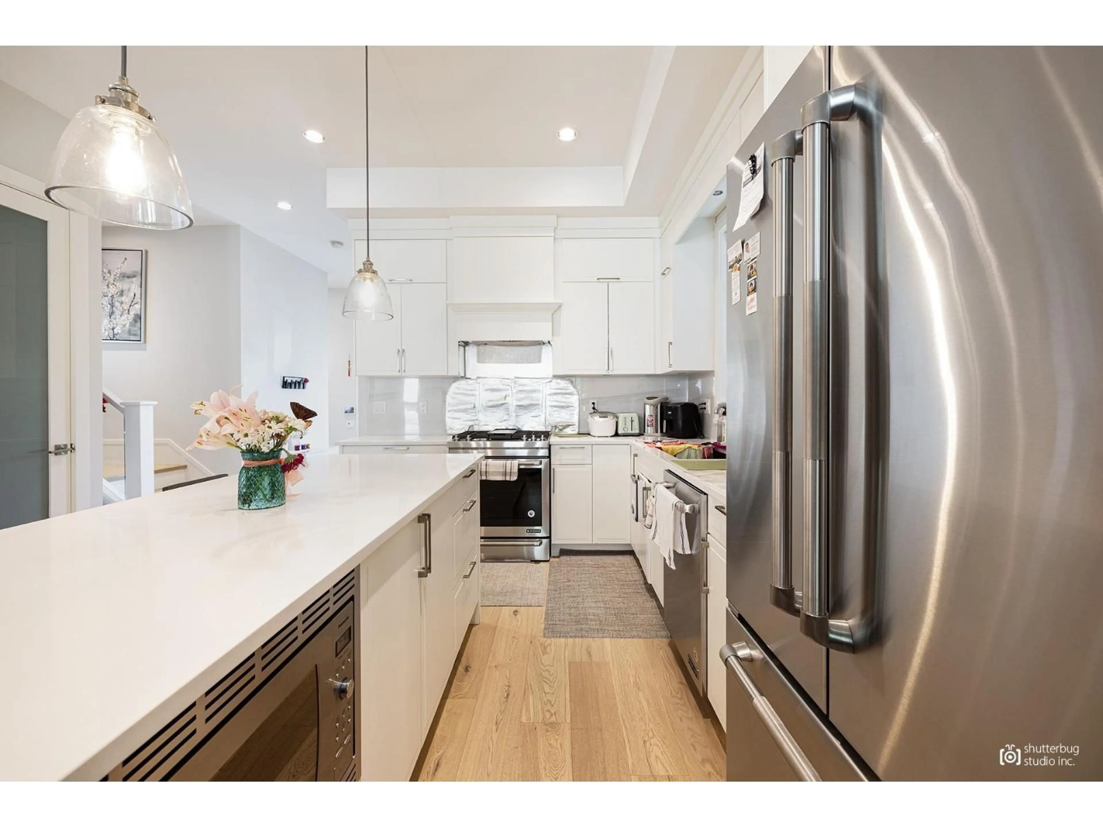 Open concept kitchen, wood/laminate floor for 16475 21A AVENUE, Surrey British Columbia V3Z0V5