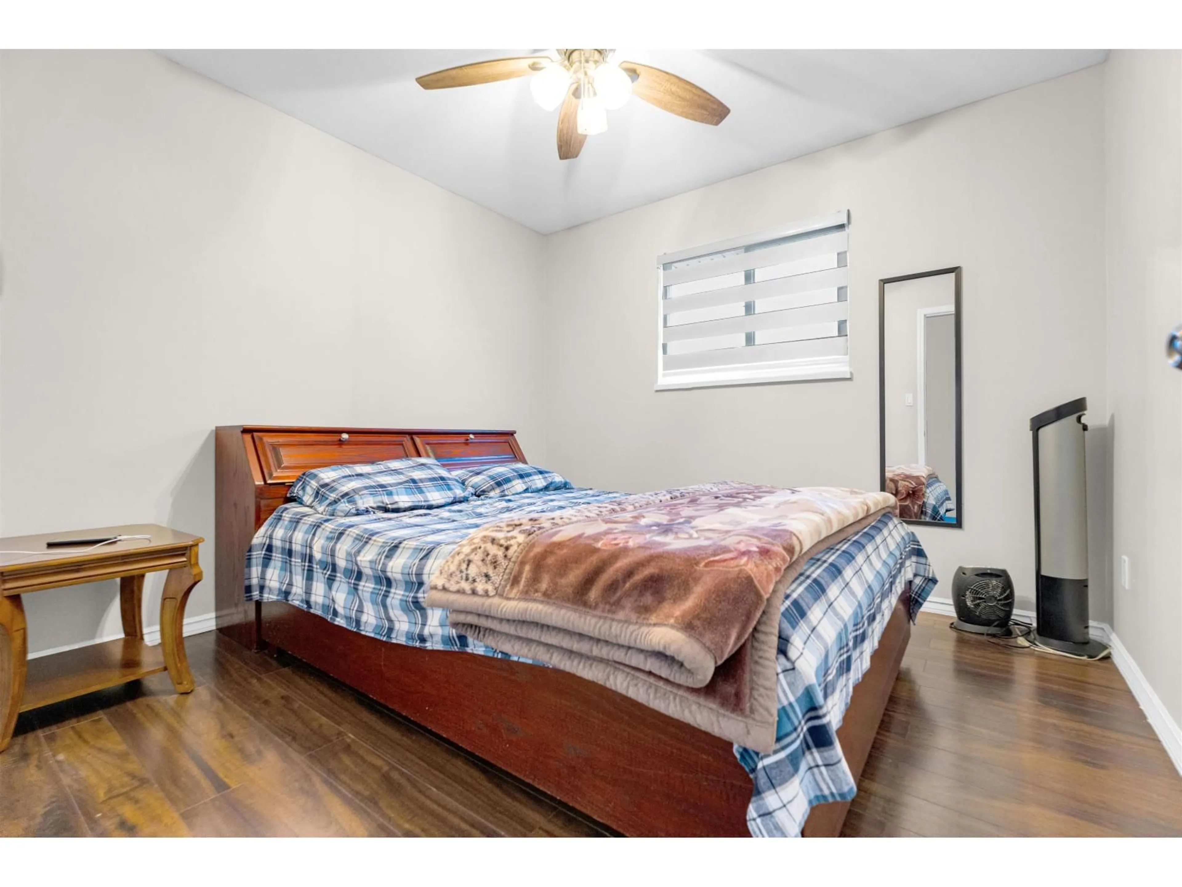 Bedroom with bed, wood/laminate floor for 7595 122A STREET, Surrey British Columbia V3W0K7