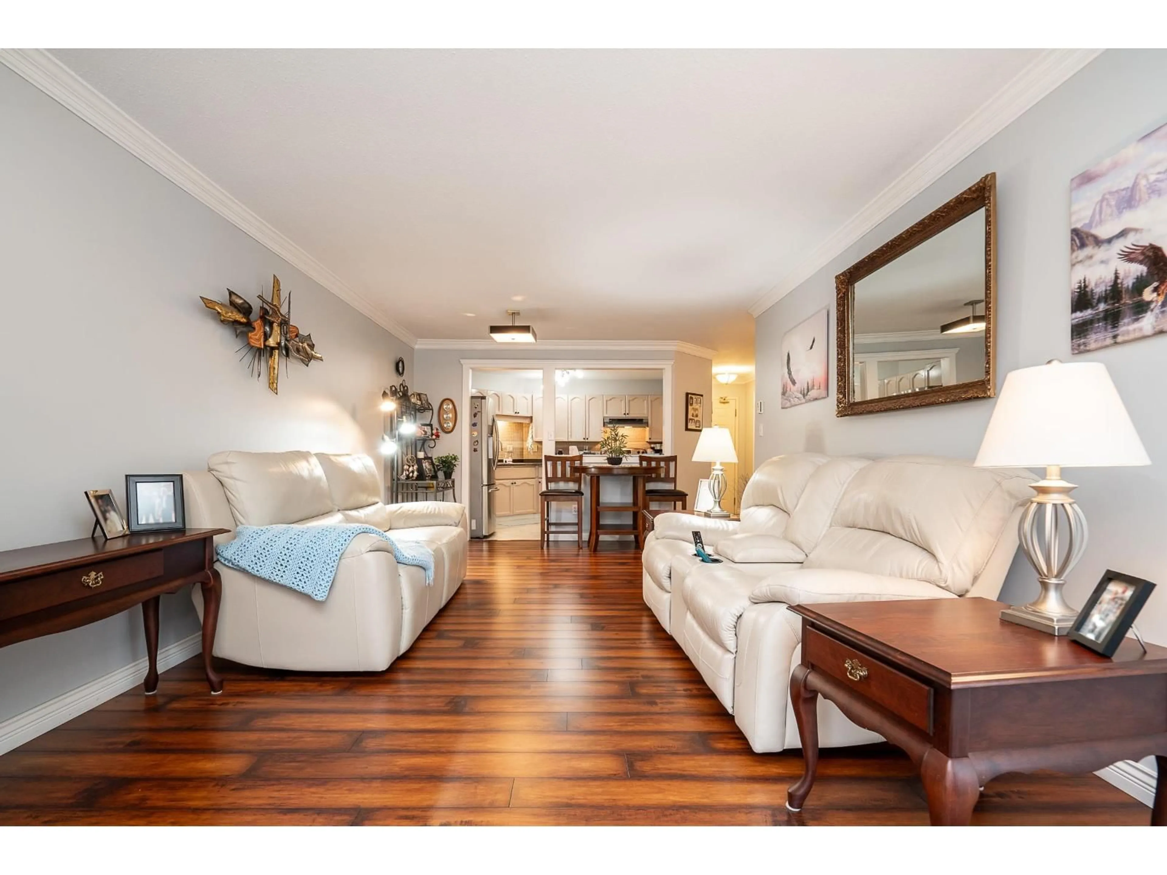 Living room with furniture, wood/laminate floor for 105 - 2410 EMERSON STREET, Abbotsford British Columbia V2T3J3