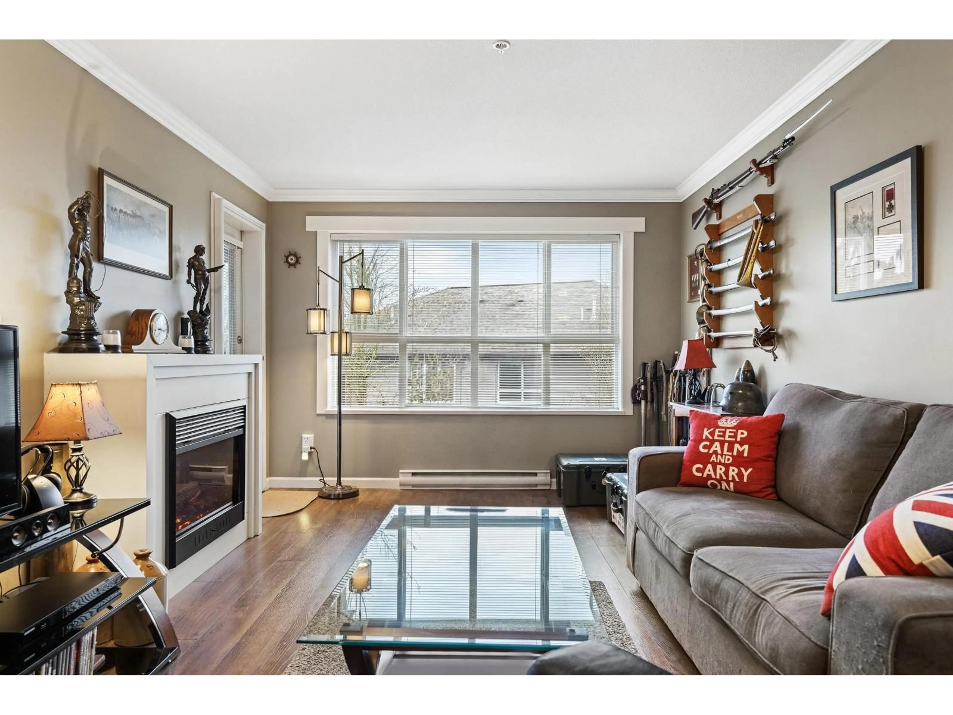 Living room with furniture, wood/laminate floor for 309 - 6815 188 STREET, Surrey British Columbia V4N0Z8