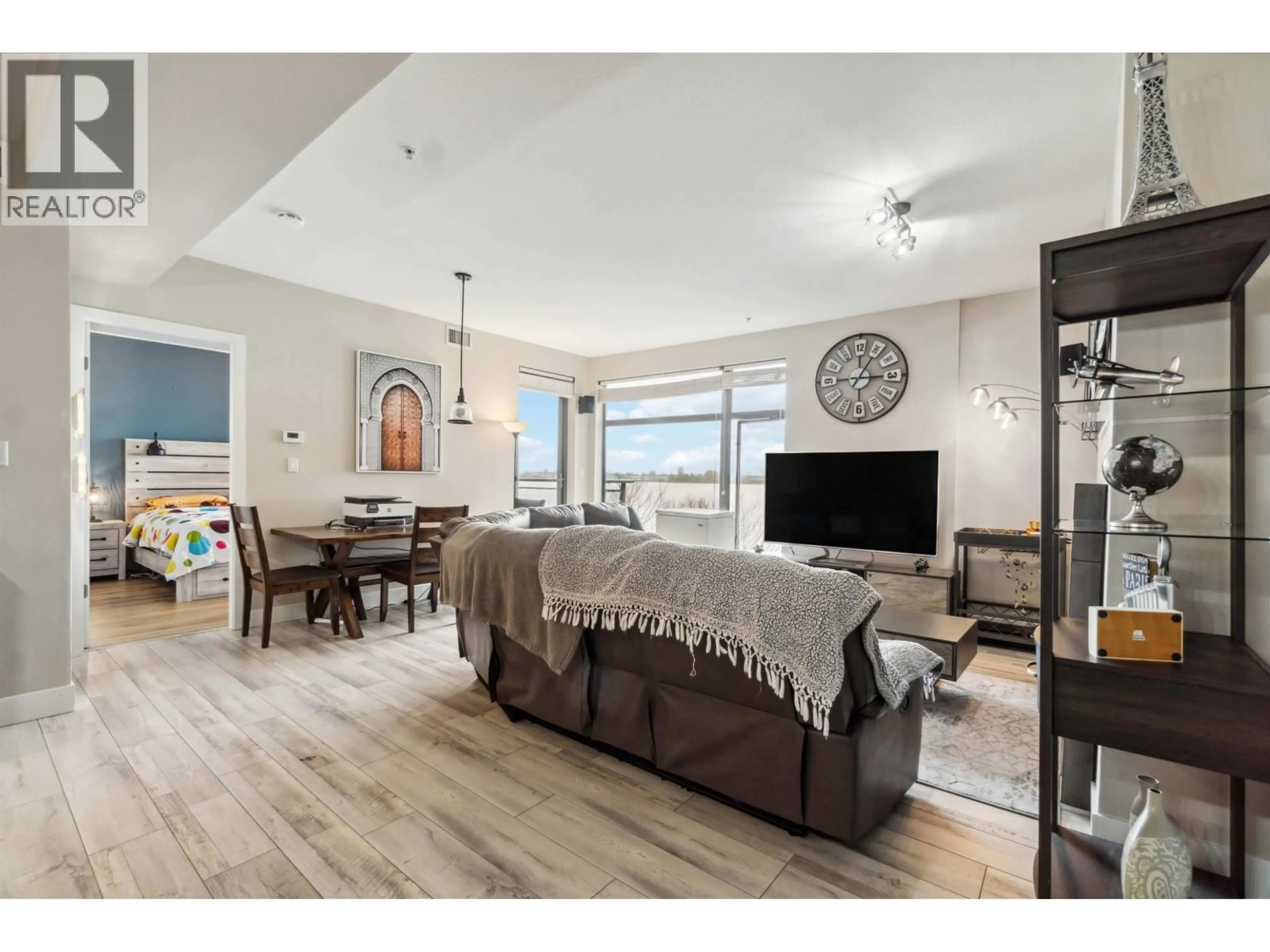 Living room with furniture, wood/laminate floor for 201 - 14300 RIVERPORT WAY, Richmond British Columbia V6W0A4