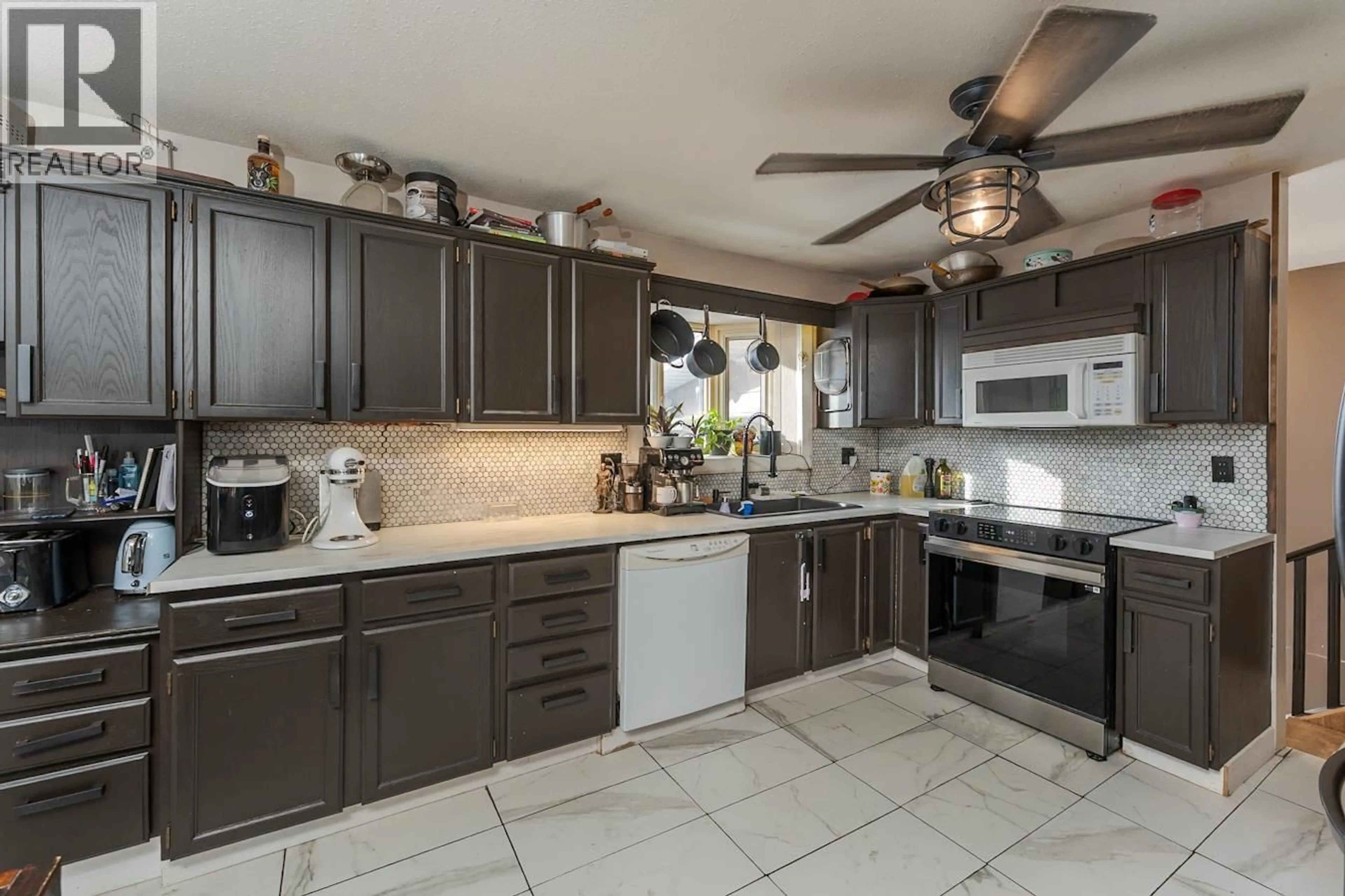 Open concept kitchen, ceramic/tile floor for 239 FERN CRESCENT, Prince George British Columbia V2N1J5