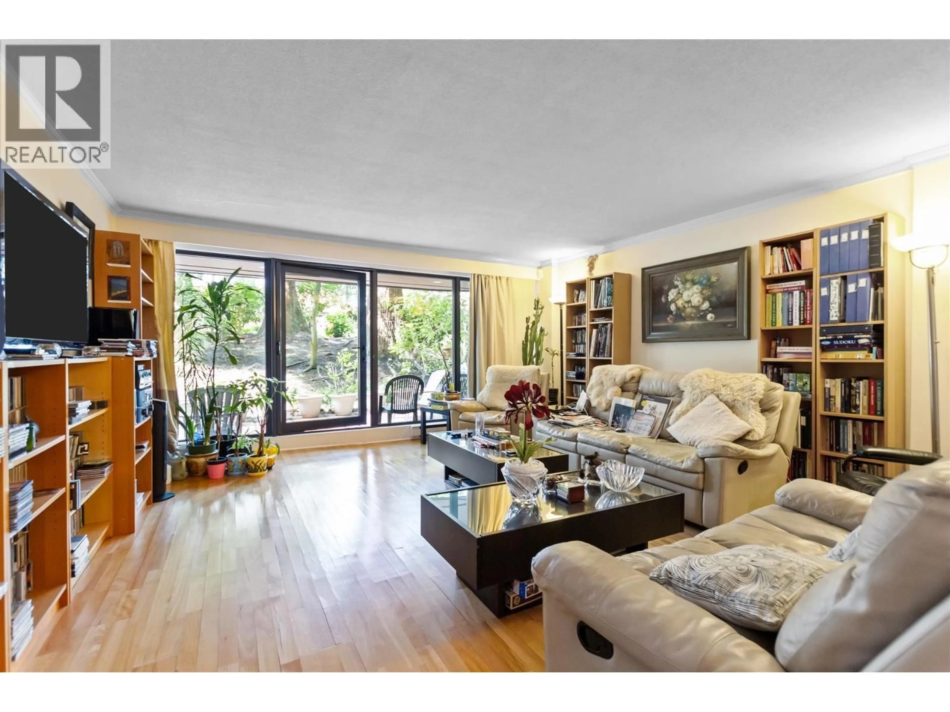 Living room with furniture, wood/laminate floor for 10 - 1425 LAMEY'S MILL ROAD, Vancouver British Columbia V6H3W2