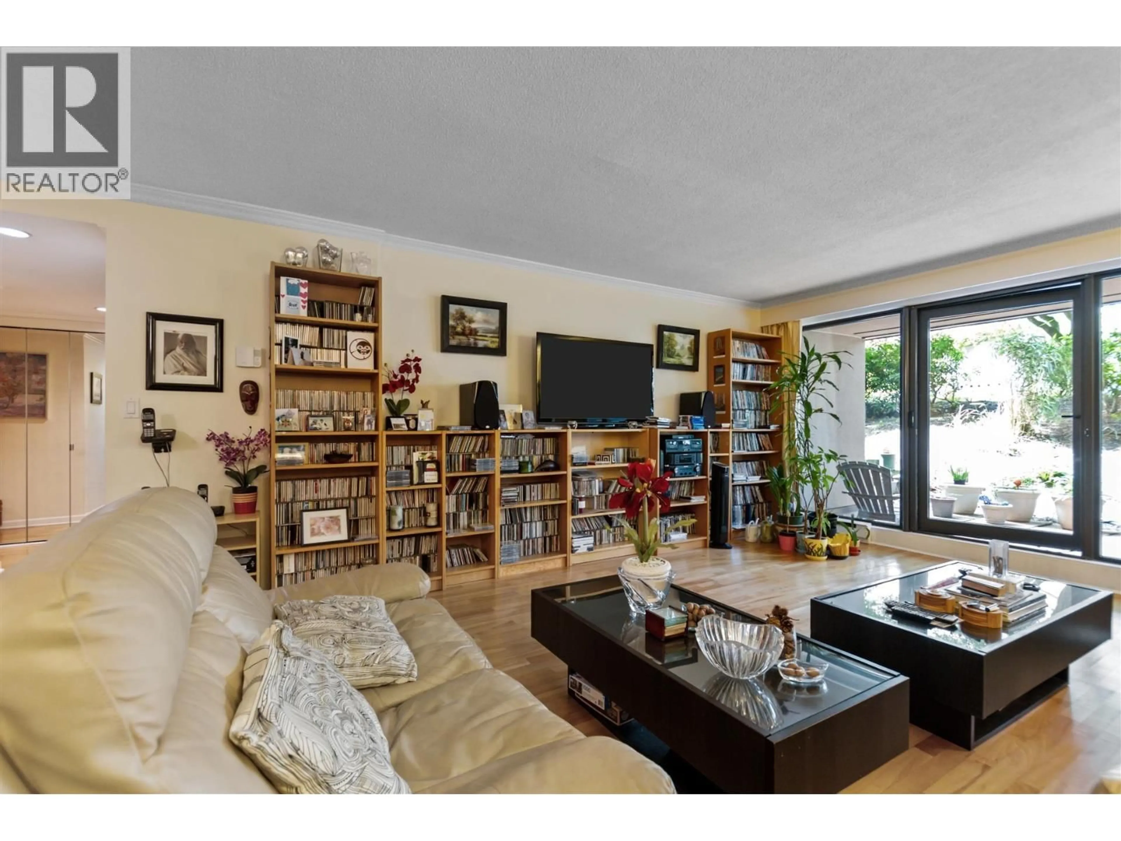 Living room with furniture, wood/laminate floor for 10 - 1425 LAMEY'S MILL ROAD, Vancouver British Columbia V6H3W2