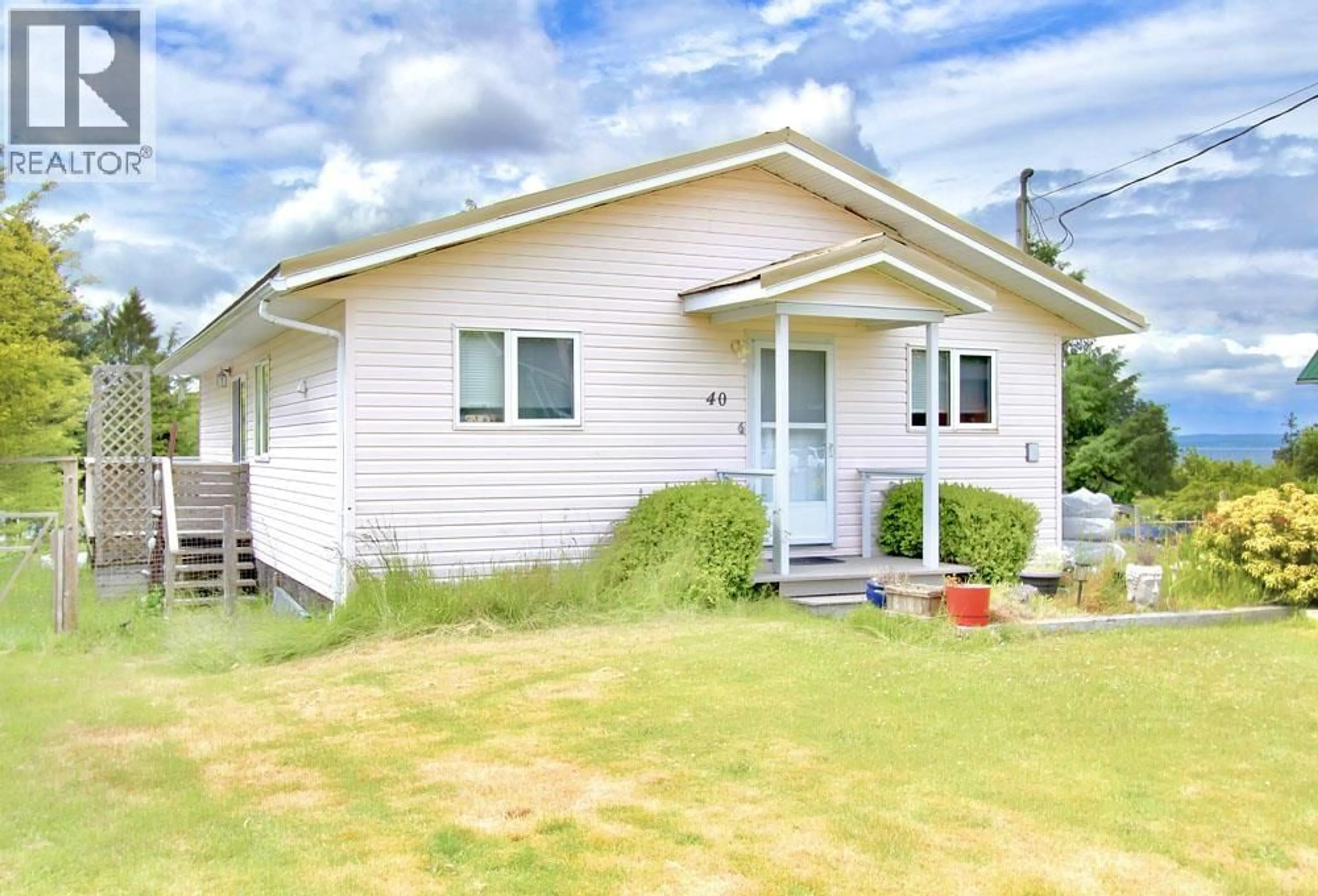 Home with vinyl exterior material, street for 40 YAKOUN STREET, Port Clements British Columbia V0T1R0