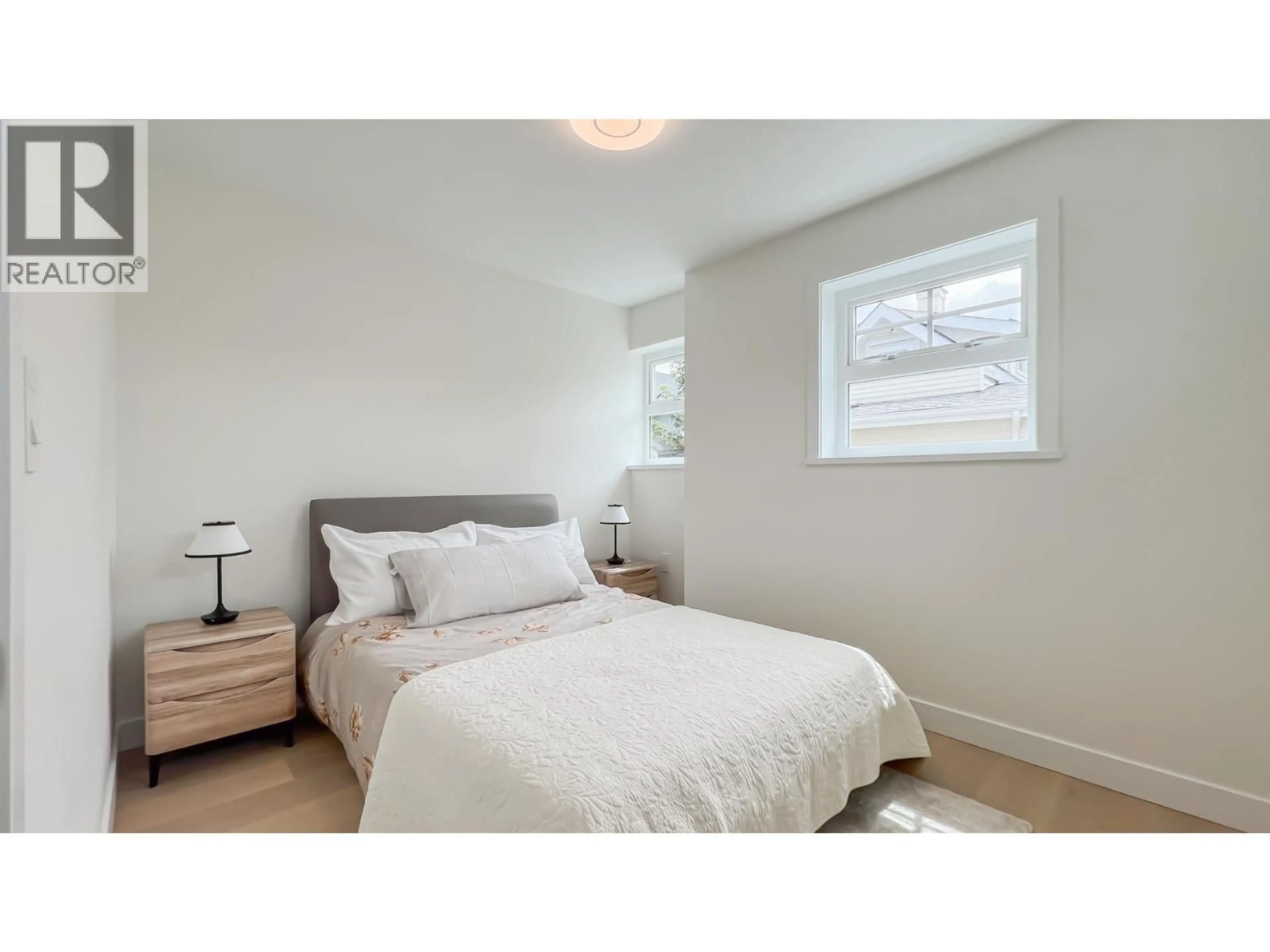 Bedroom with bed, wood/laminate floor for 1155 KEEFER STREET, Vancouver British Columbia V6A1Z2