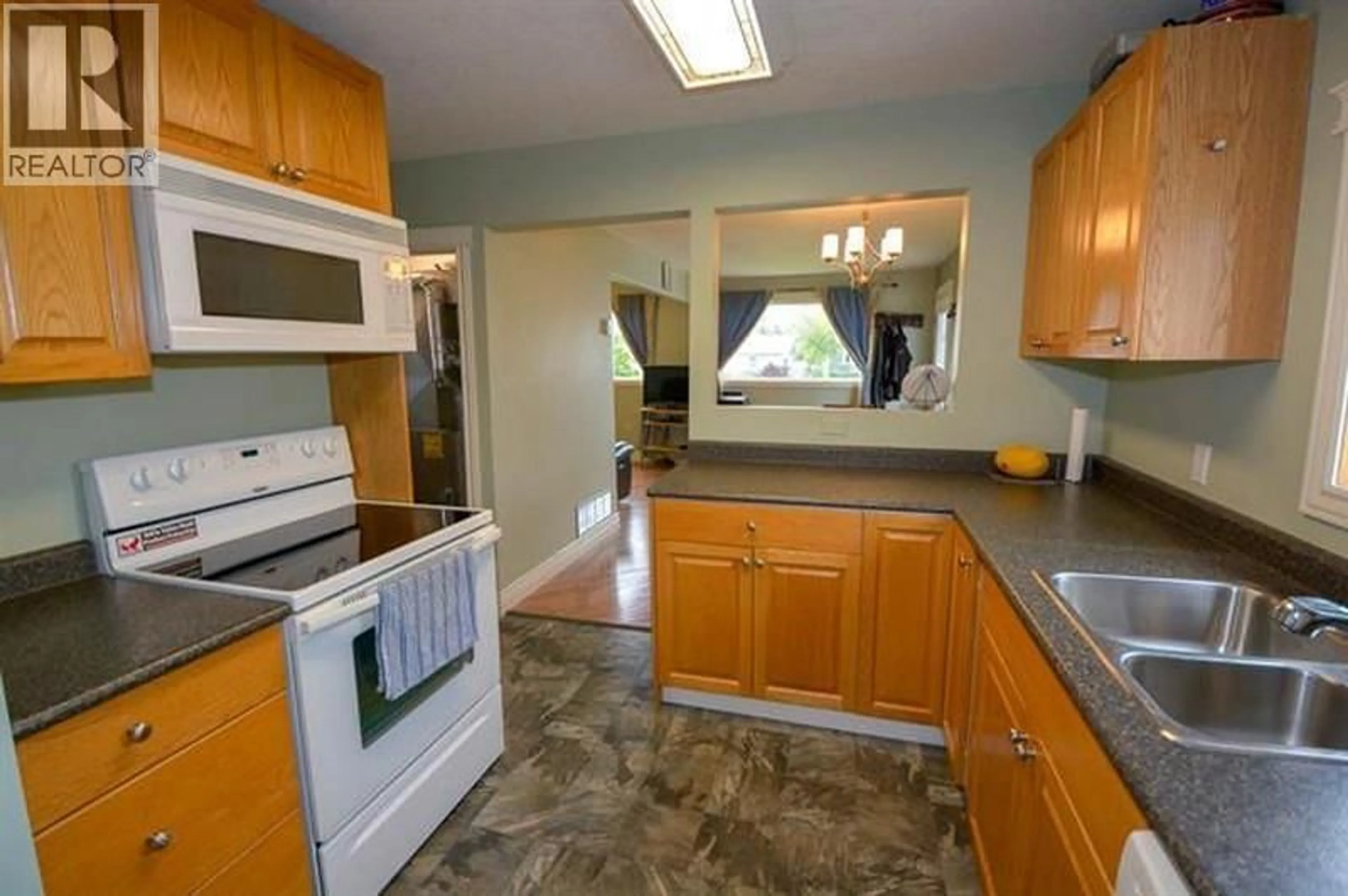 Standard kitchen, ceramic/tile floor for 9223 106 AVENUE, Fort St. John British Columbia V1J2N5