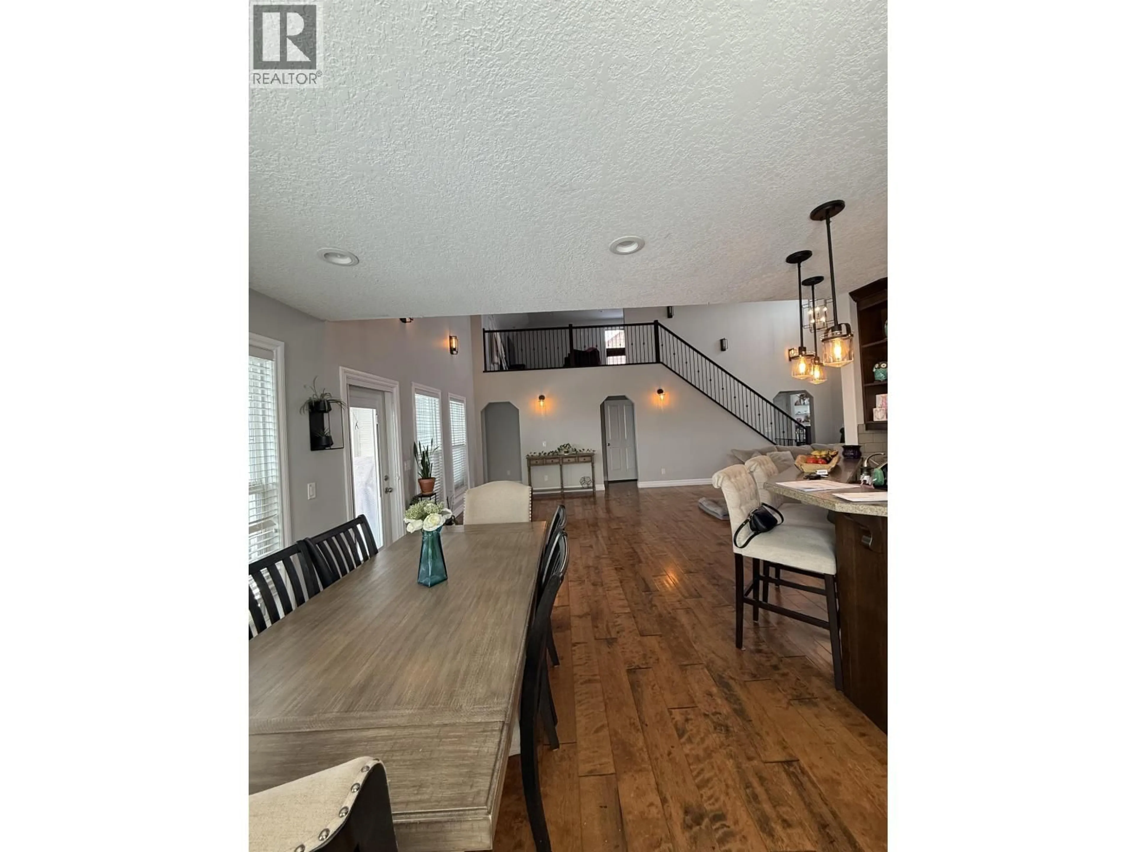 Open concept kitchen, wood/laminate floor for 10512 108 STREET, Fort St. John British Columbia V1J0J3