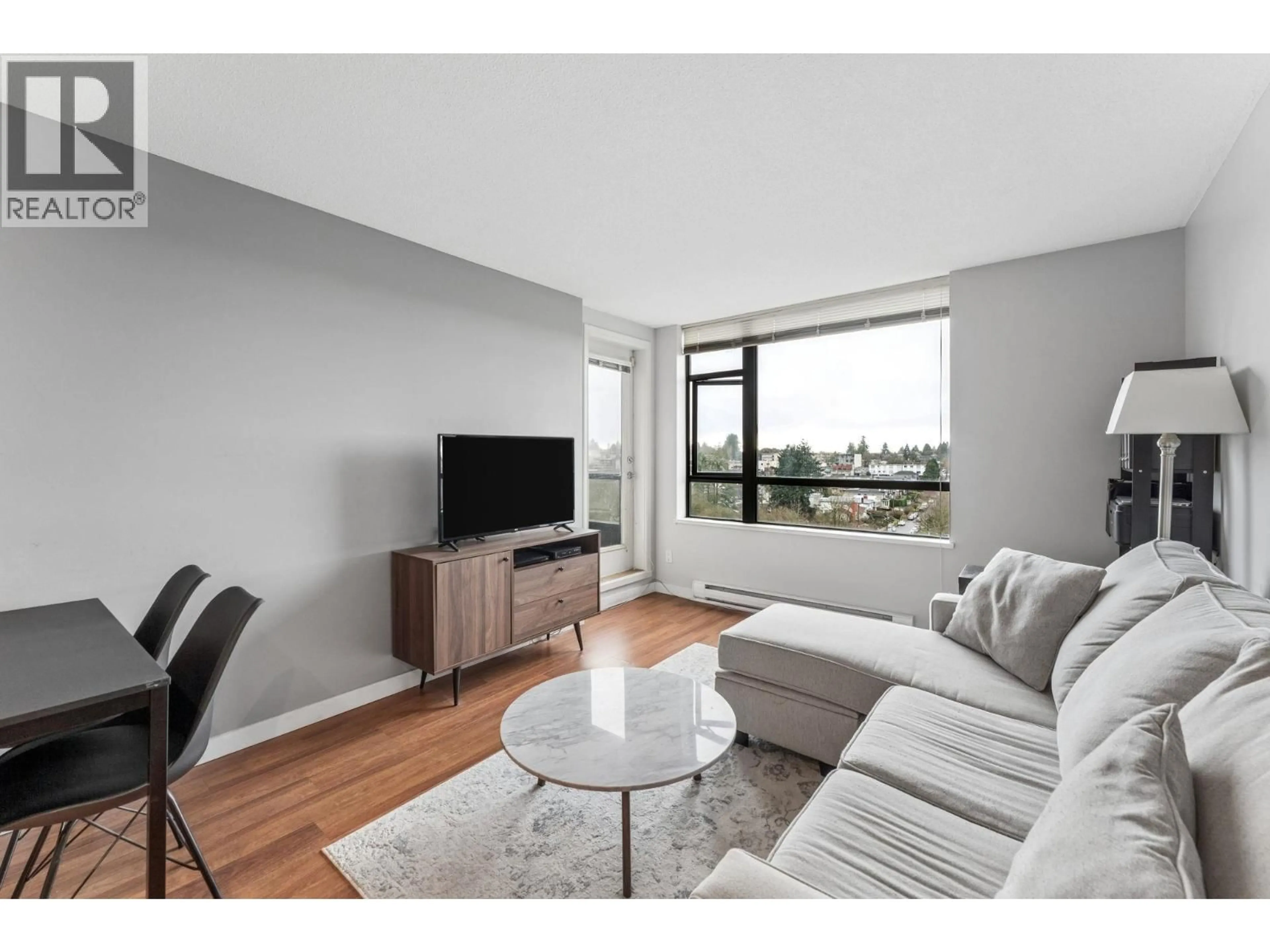 Living room with furniture, wood/laminate floor for 901 - 3520 CROWLEY DRIVE, Vancouver British Columbia V5R6G9