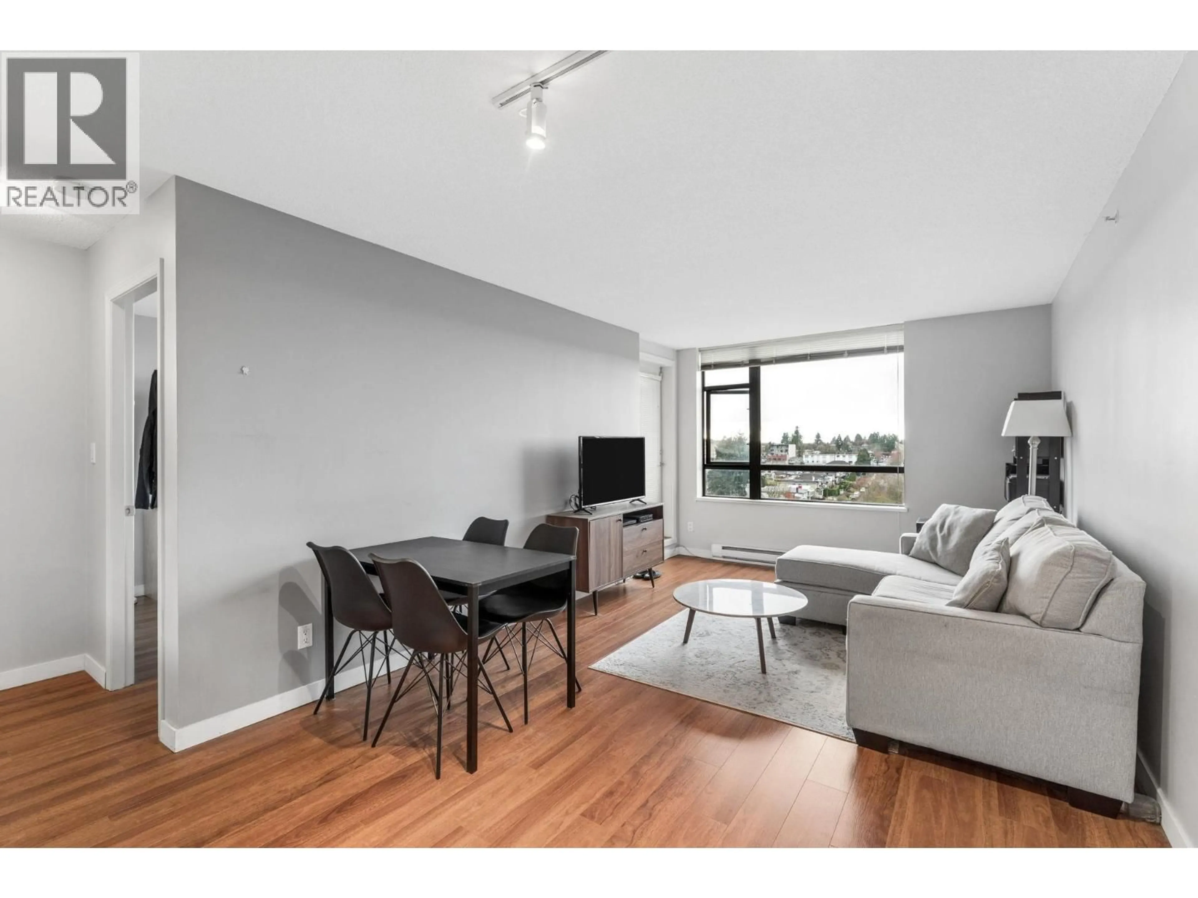 Living room with furniture, wood/laminate floor for 901 - 3520 CROWLEY DRIVE, Vancouver British Columbia V5R6G9