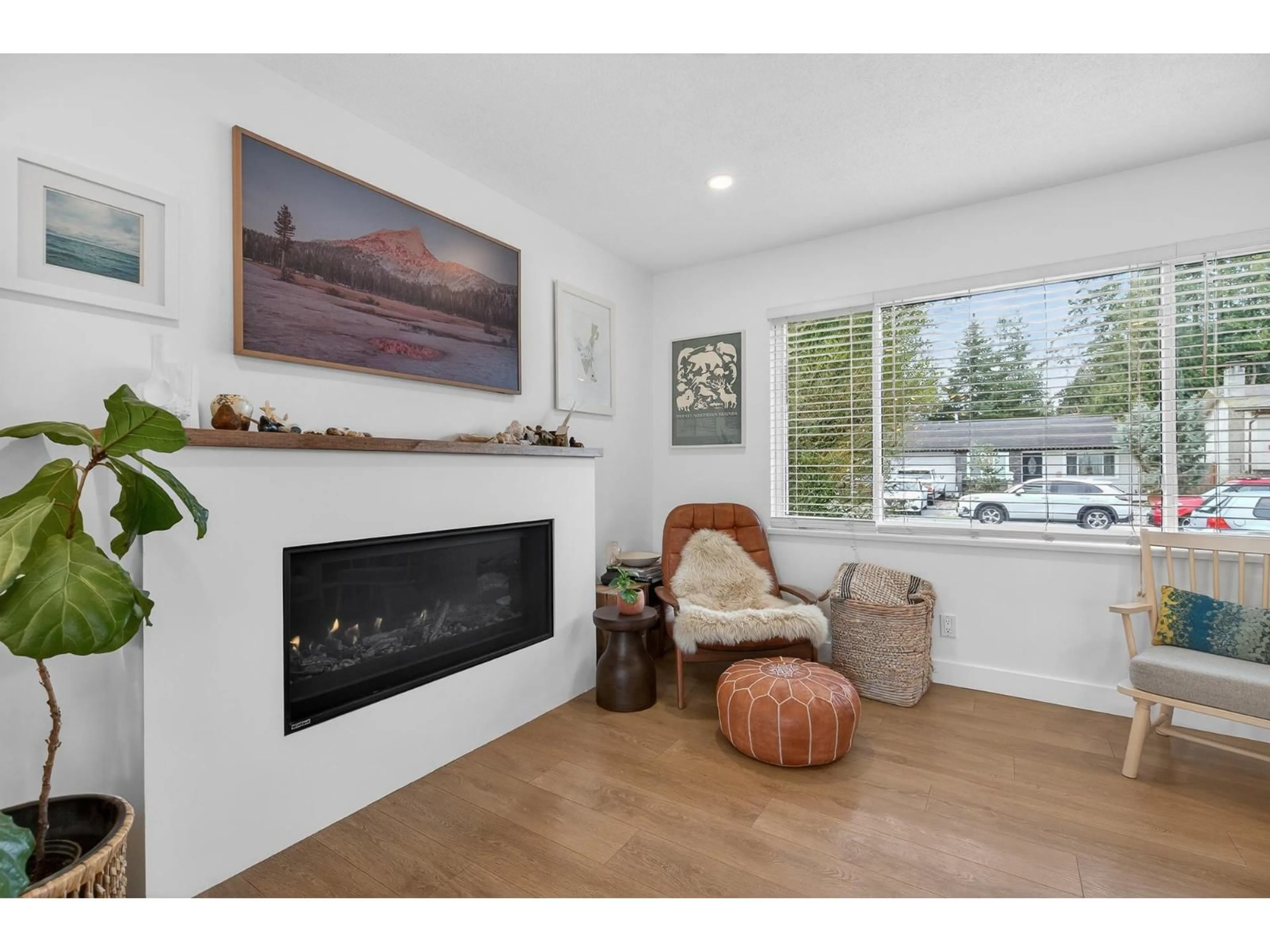 Living room with furniture, wood/laminate floor for 4428 203 STREET, Langley British Columbia V3A6P7