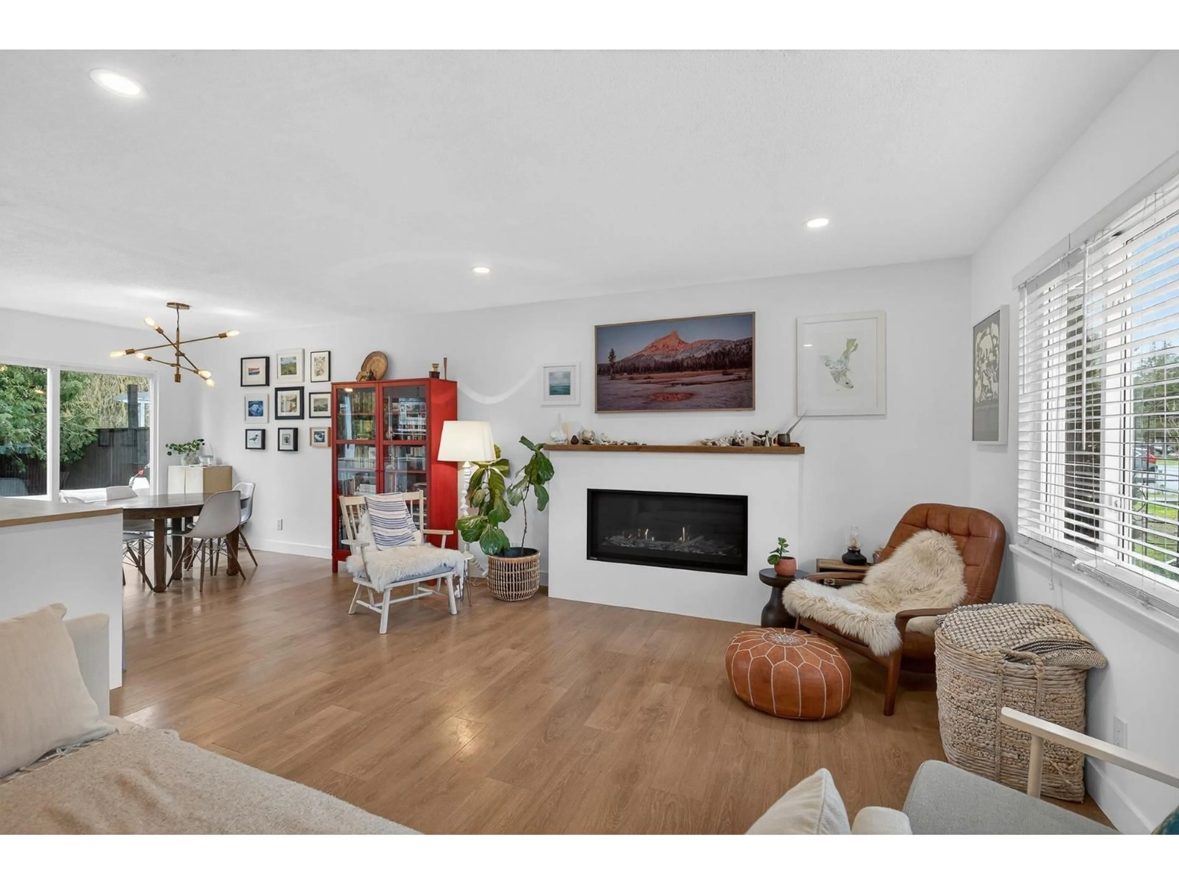 Living room with furniture, wood/laminate floor for 4428 203 STREET, Langley British Columbia V3A6P7