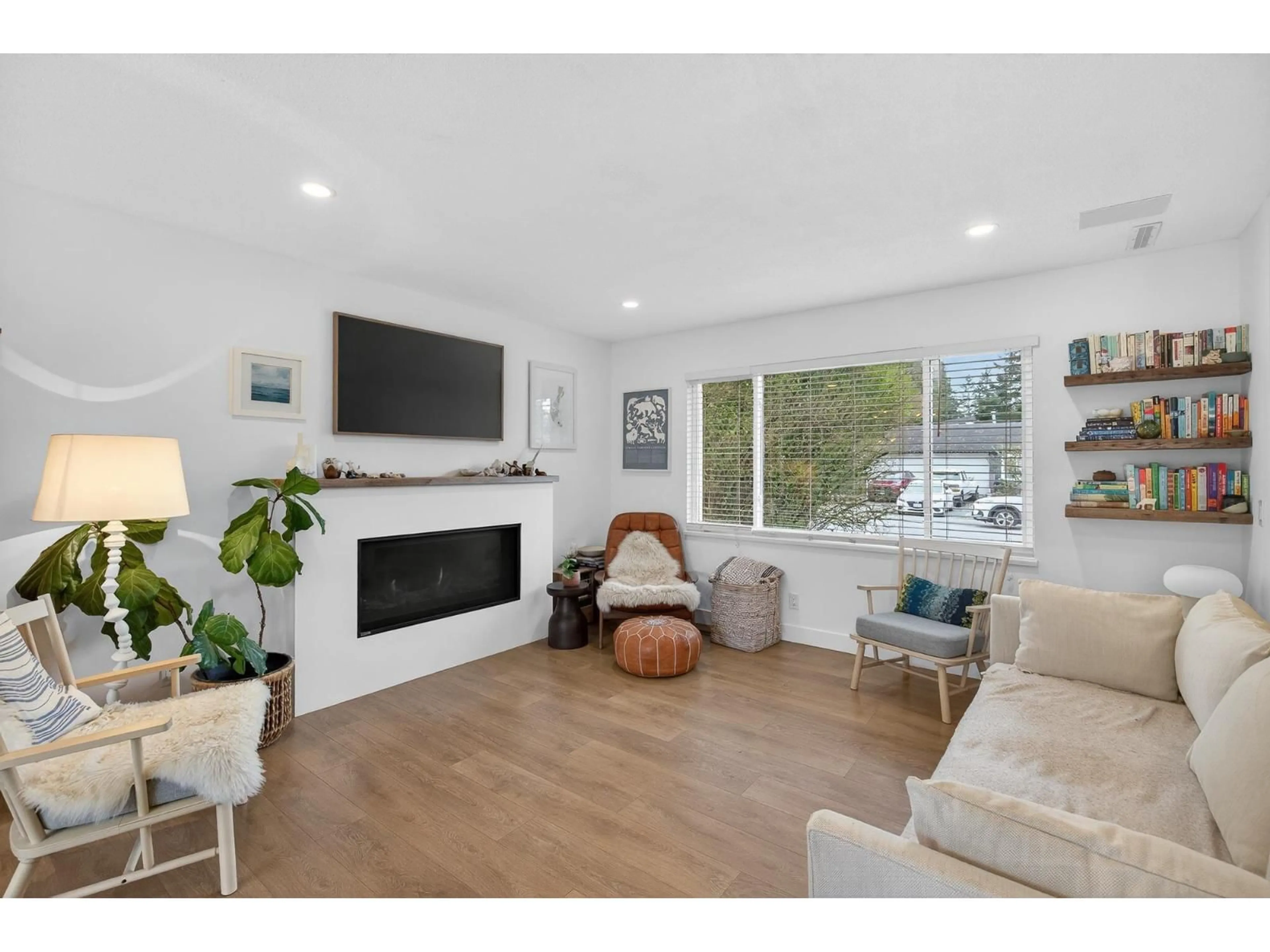 Living room with furniture, wood/laminate floor for 4428 203 STREET, Langley British Columbia V3A6P7