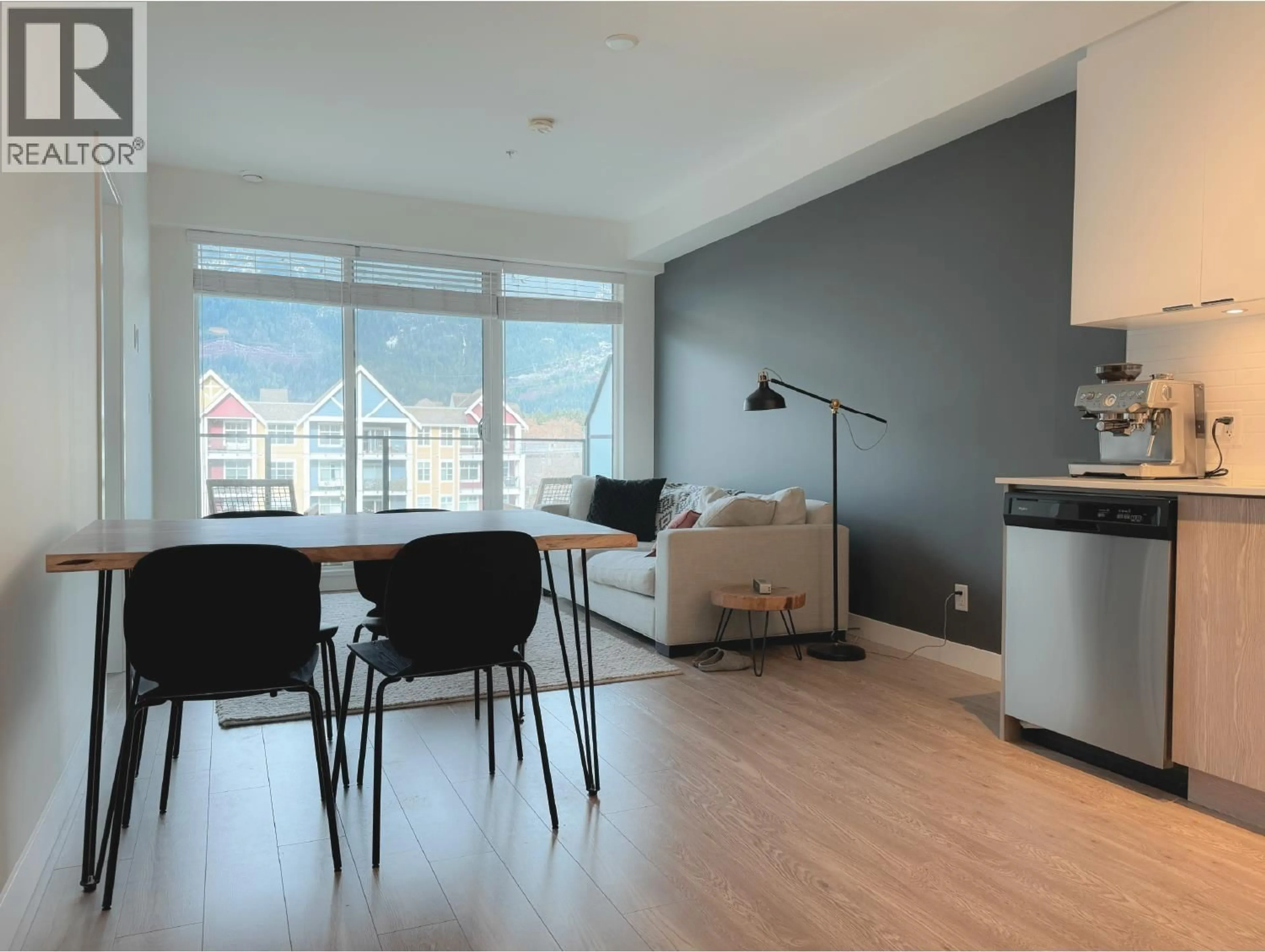 Living room with furniture, wood/laminate floor for 417 - 37881 CLEVELAND AVENUE, Squamish British Columbia V8B0Z7