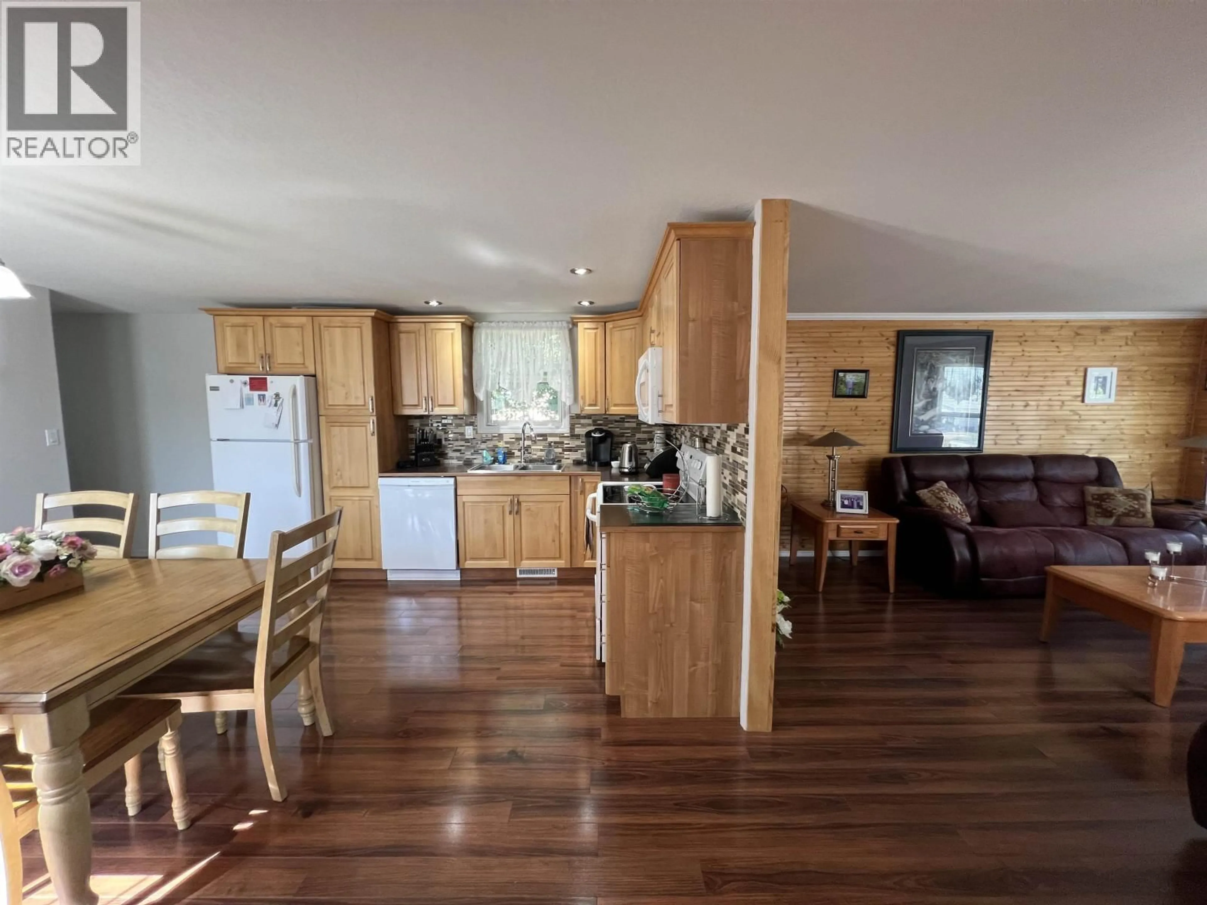 Open concept kitchen, wood/laminate floor for 5223 41 STREET, Fort Nelson British Columbia V0C1R0