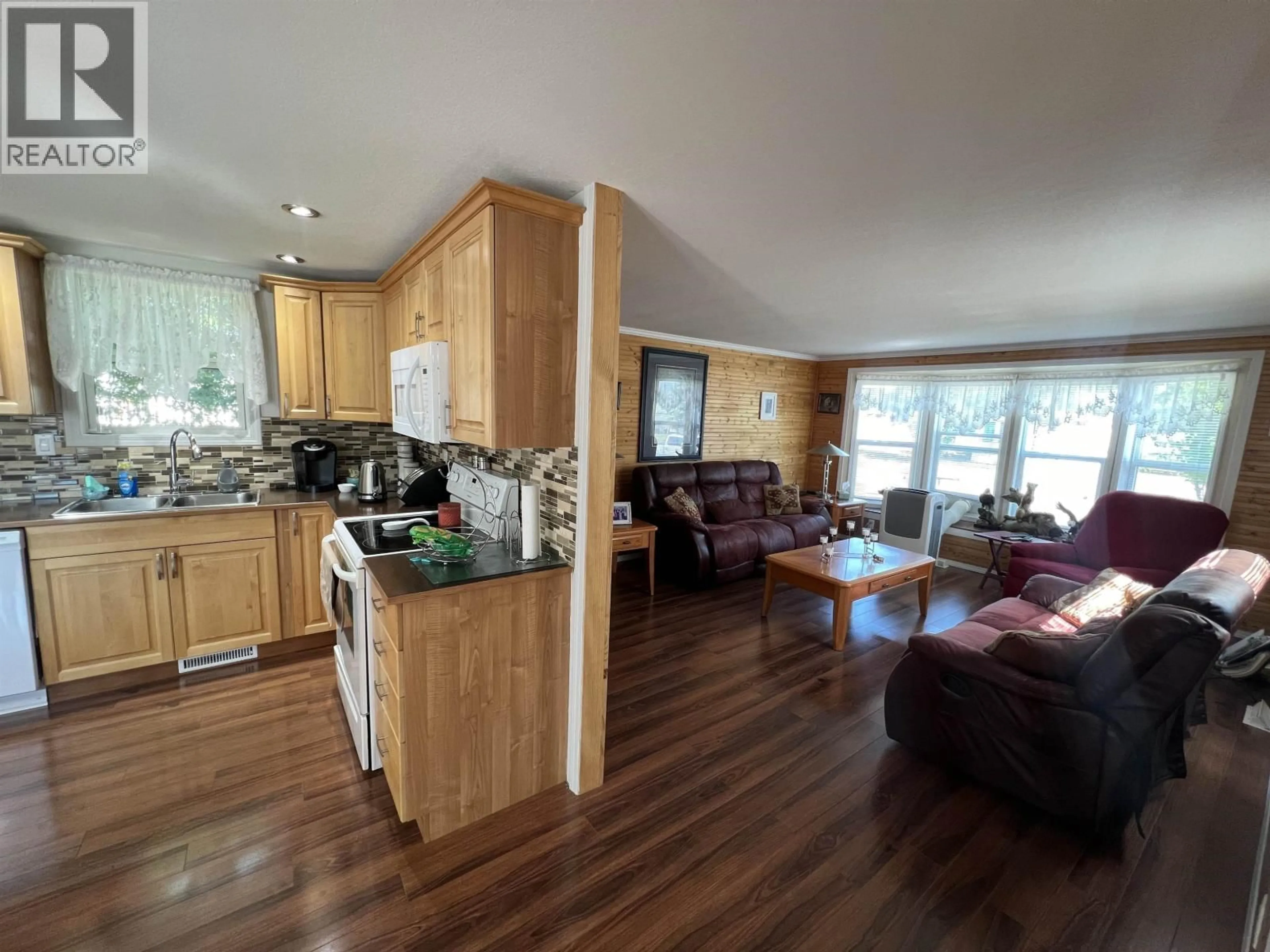 Open concept kitchen, wood/laminate floor for 5223 41 STREET, Fort Nelson British Columbia V0C1R0