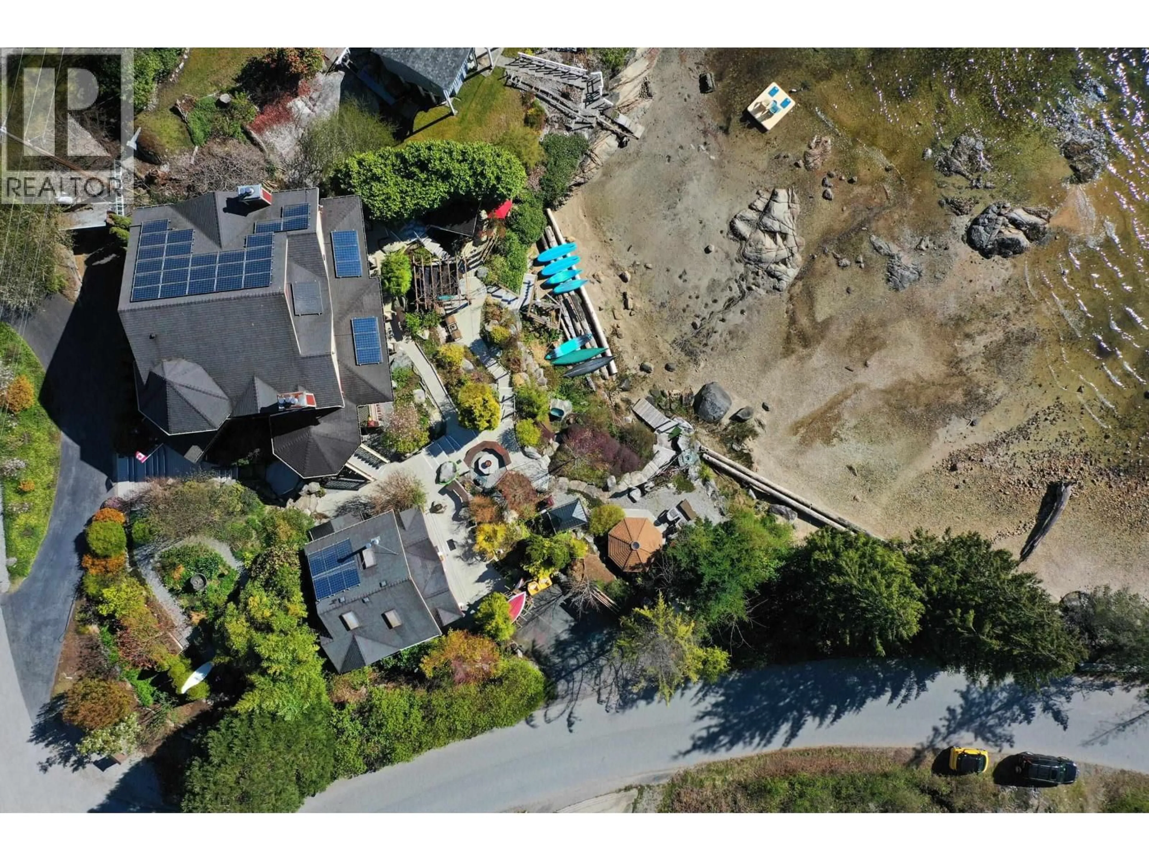A pic from outside/outdoor area/front of a property/back of a property/a pic from drone, street for 7545 ISLETS PLACE, Sechelt British Columbia V7Z0C5