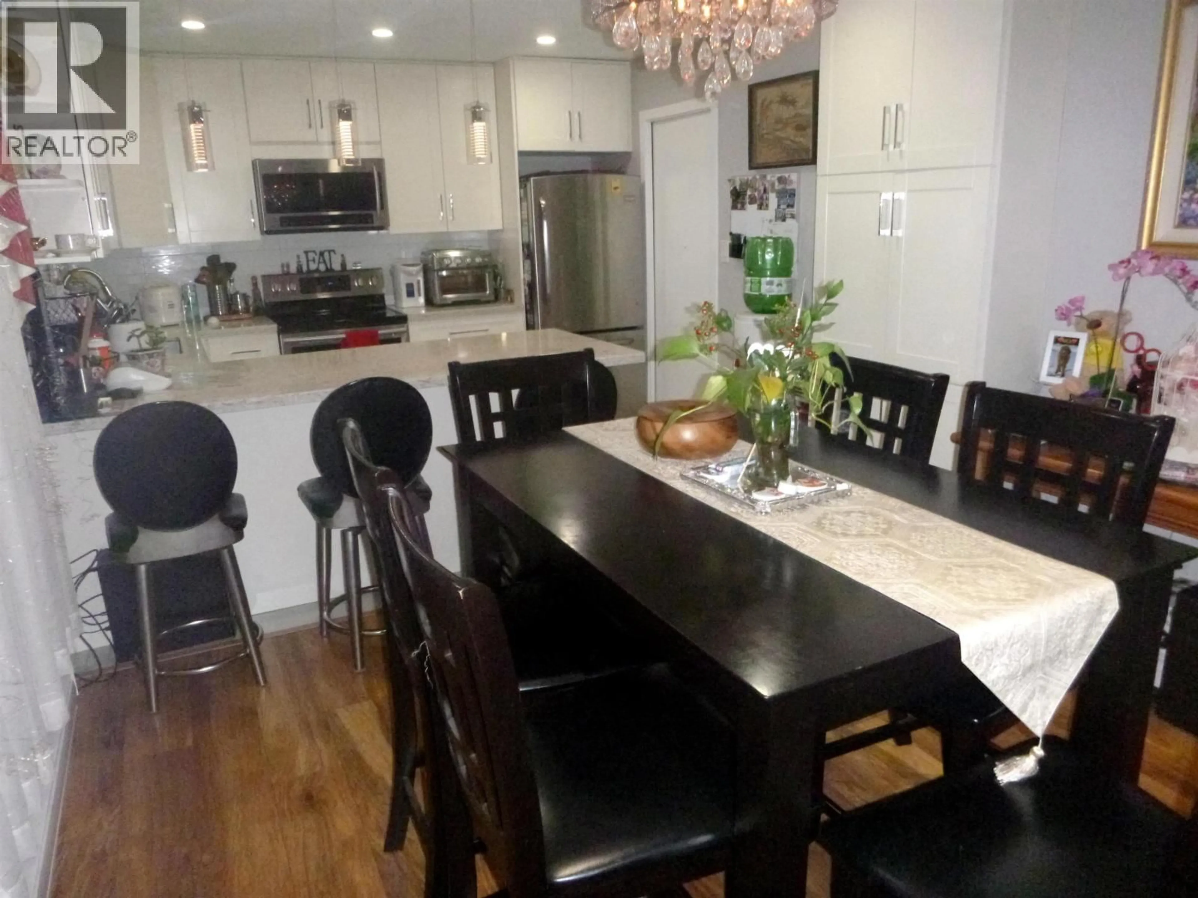 Open concept kitchen, wood/laminate floor for 11171 STEVESTON HIGHWAY, Richmond British Columbia V7A1N7