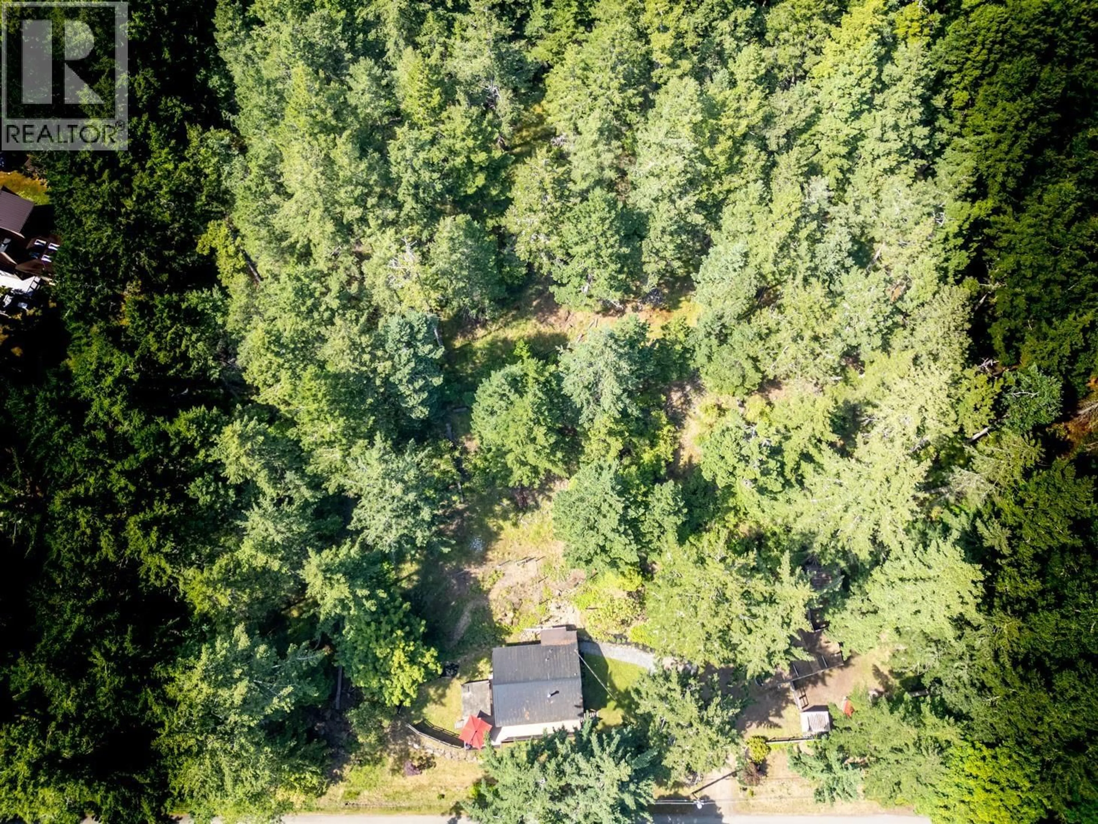 A pic from outside/outdoor area/front of a property/back of a property/a pic from drone, forest/trees view for 9907 GOWLLAND POINT ROAD, Pender Island British Columbia V0N2M3