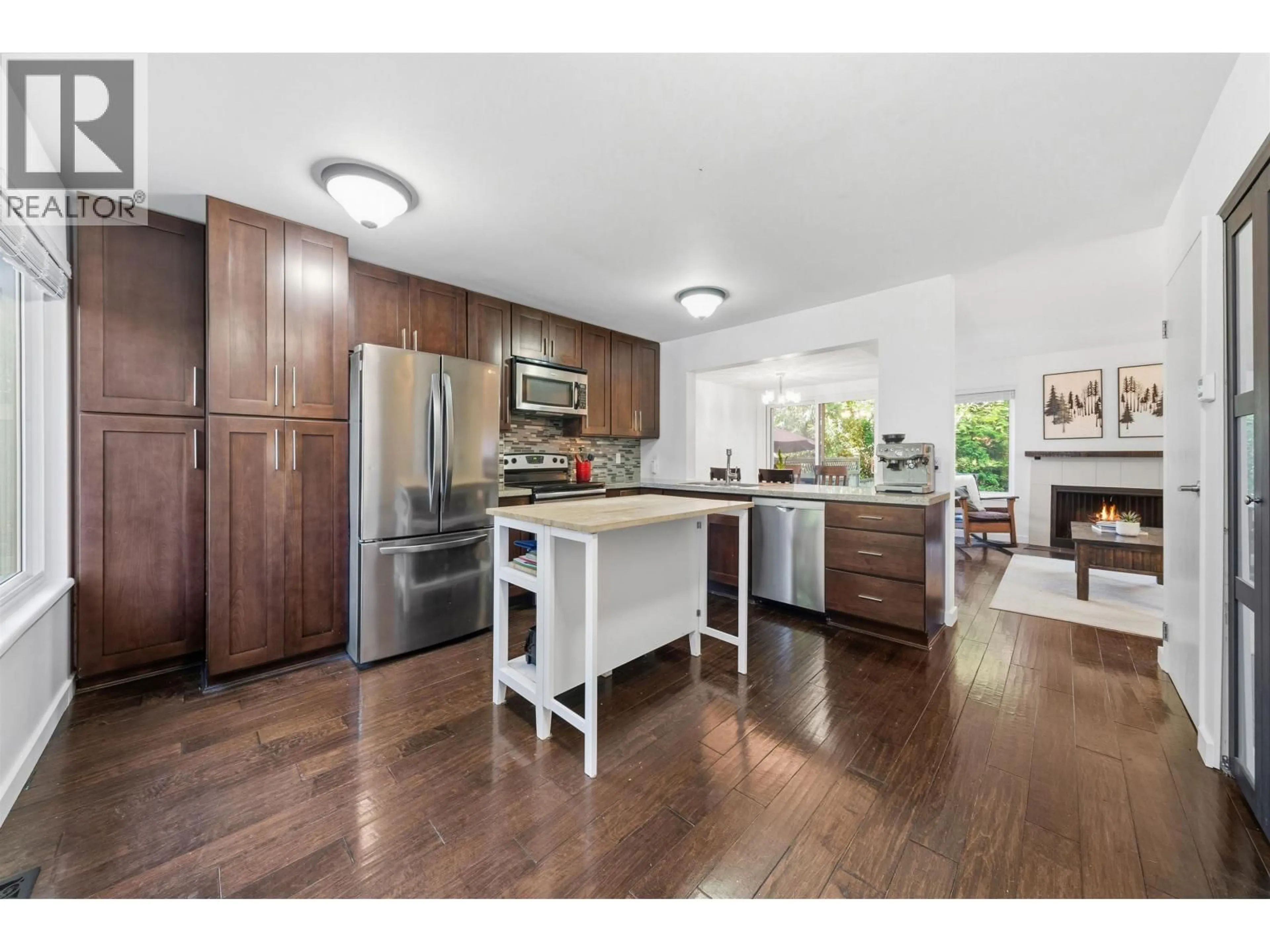 Open concept kitchen, wood/laminate floor for 4742 LAURELWOOD PLACE, Burnaby British Columbia V5G4B2